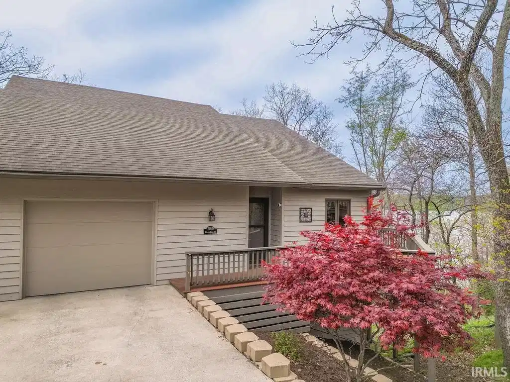 Image 0: View of front of home featuring roof with shingles, a deck, concrete driveway, and a garage, Front Of Structure Image 0: View of front of home featuring roof with shingles, a deck, concrete driveway, and a garage, Front Of Structure