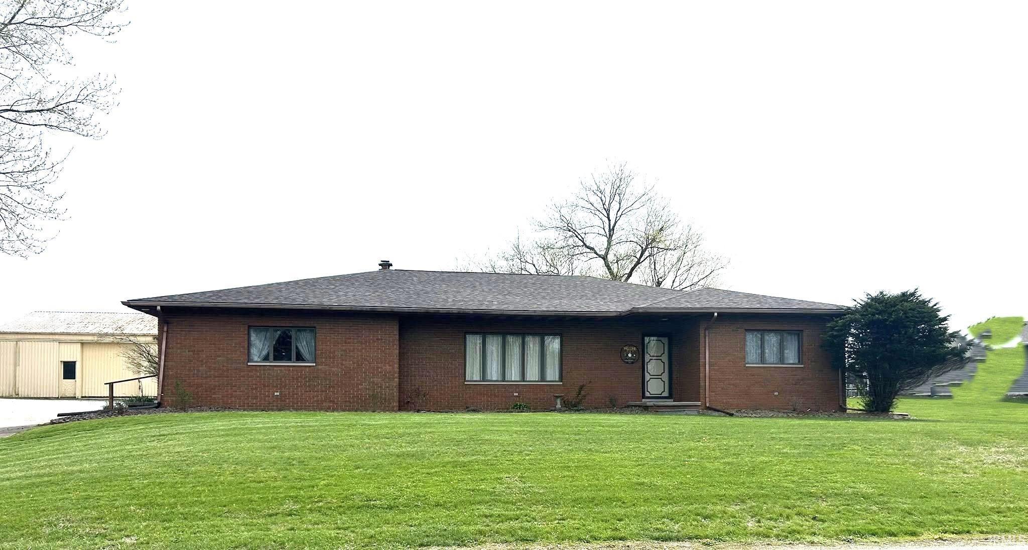 Image 0: Single story home with brick siding, a front lawn, and a shingled roof, Front Of Structure Image 0: Single story home with brick siding, a front lawn, and a shingled roof, Front Of Structure