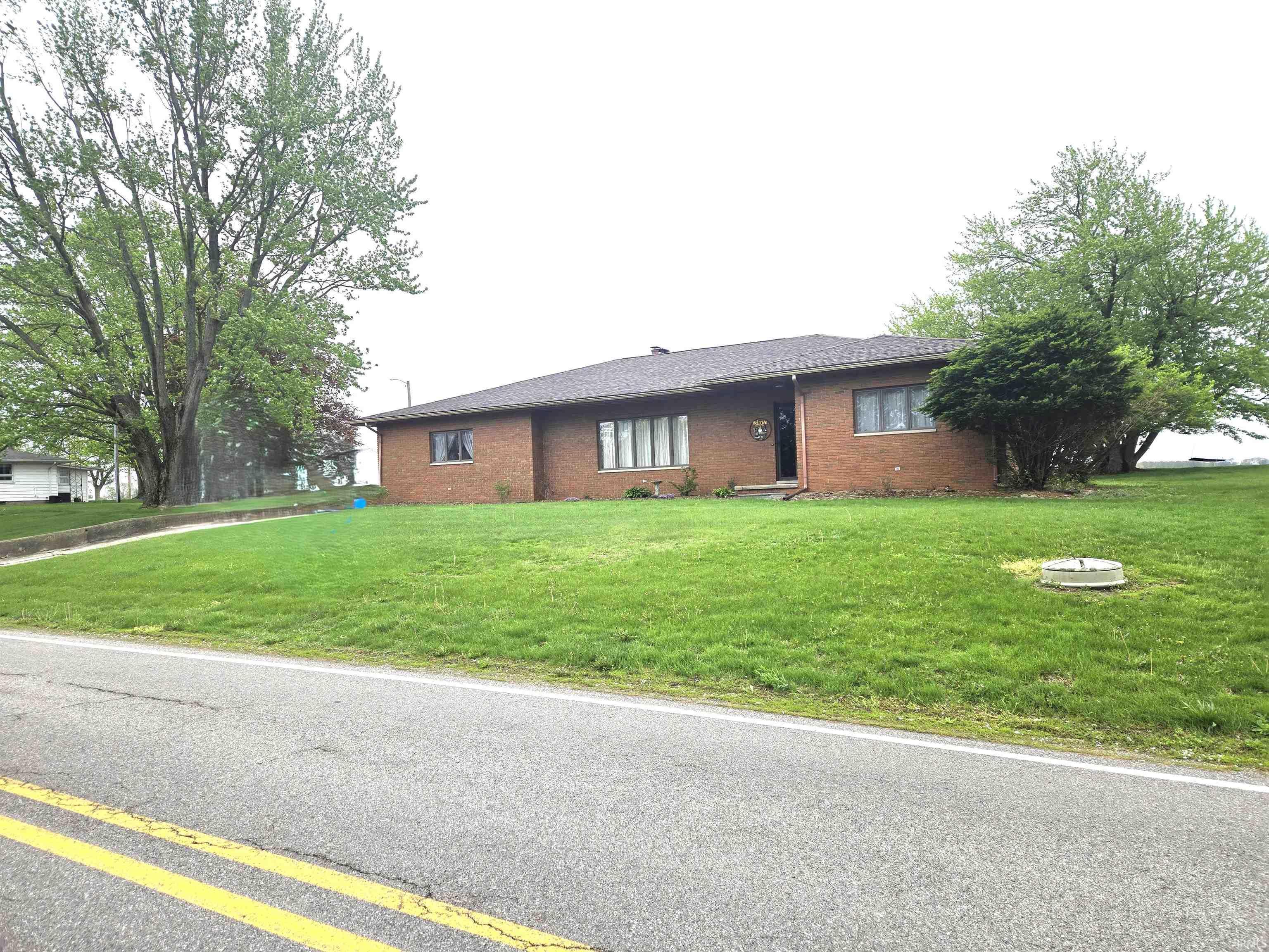 Image 3: Ranch-style house featuring brick siding and a front yard, Front Of Structure Image 3: Ranch-style house featuring brick siding and a front yard, Front Of Structure
