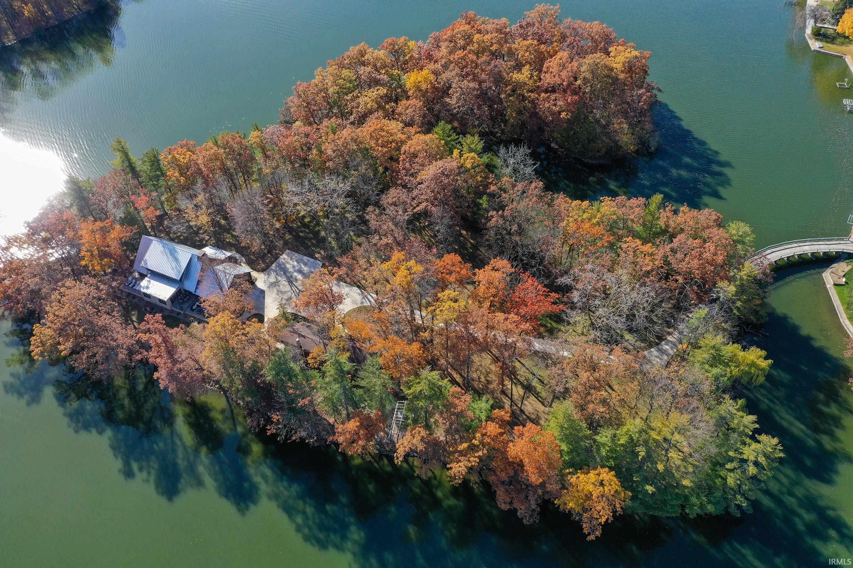 Image 0: Aerial view of property and surrounding area featuring a nearby body of water, Aerial View