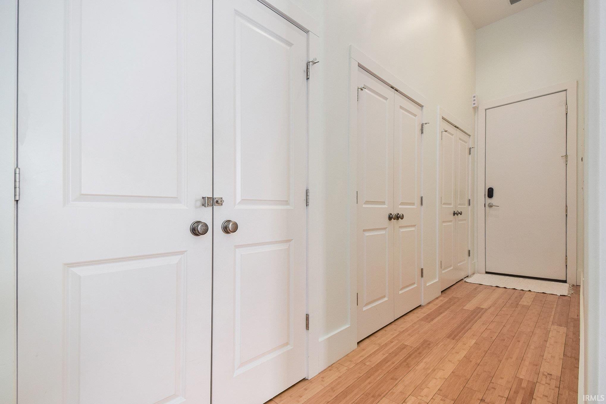 Image 1: Hallway featuring light wood-type flooring, Hallway