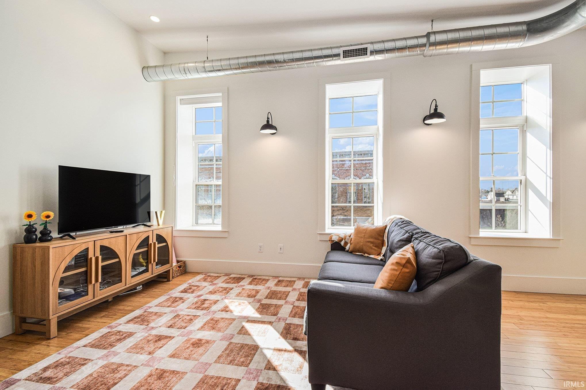 Image 3: Living room featuring light wood-style flooring, Living Room