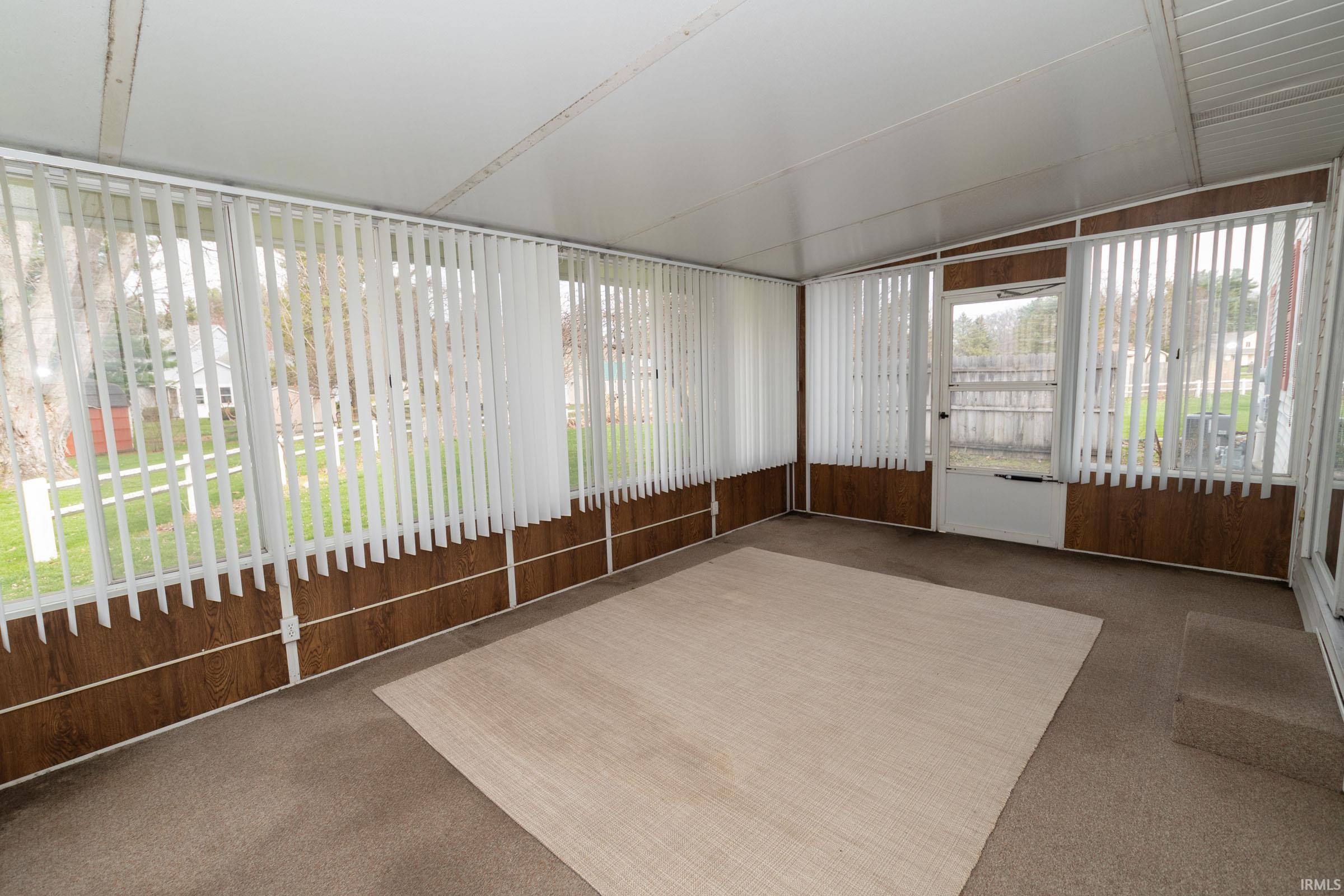 Image 3: Unfurnished sunroom featuring vaulted ceiling, Sun Room