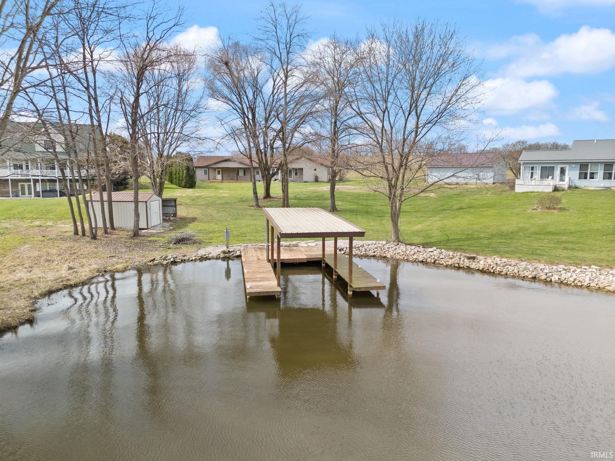 Image 3: Dock with a water view and a lawn, Dock