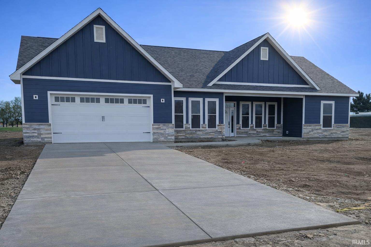 Image 2: Craftsman-style house featuring Hardie board siding and covered porch - Actual photo during construction, Front Of Structure