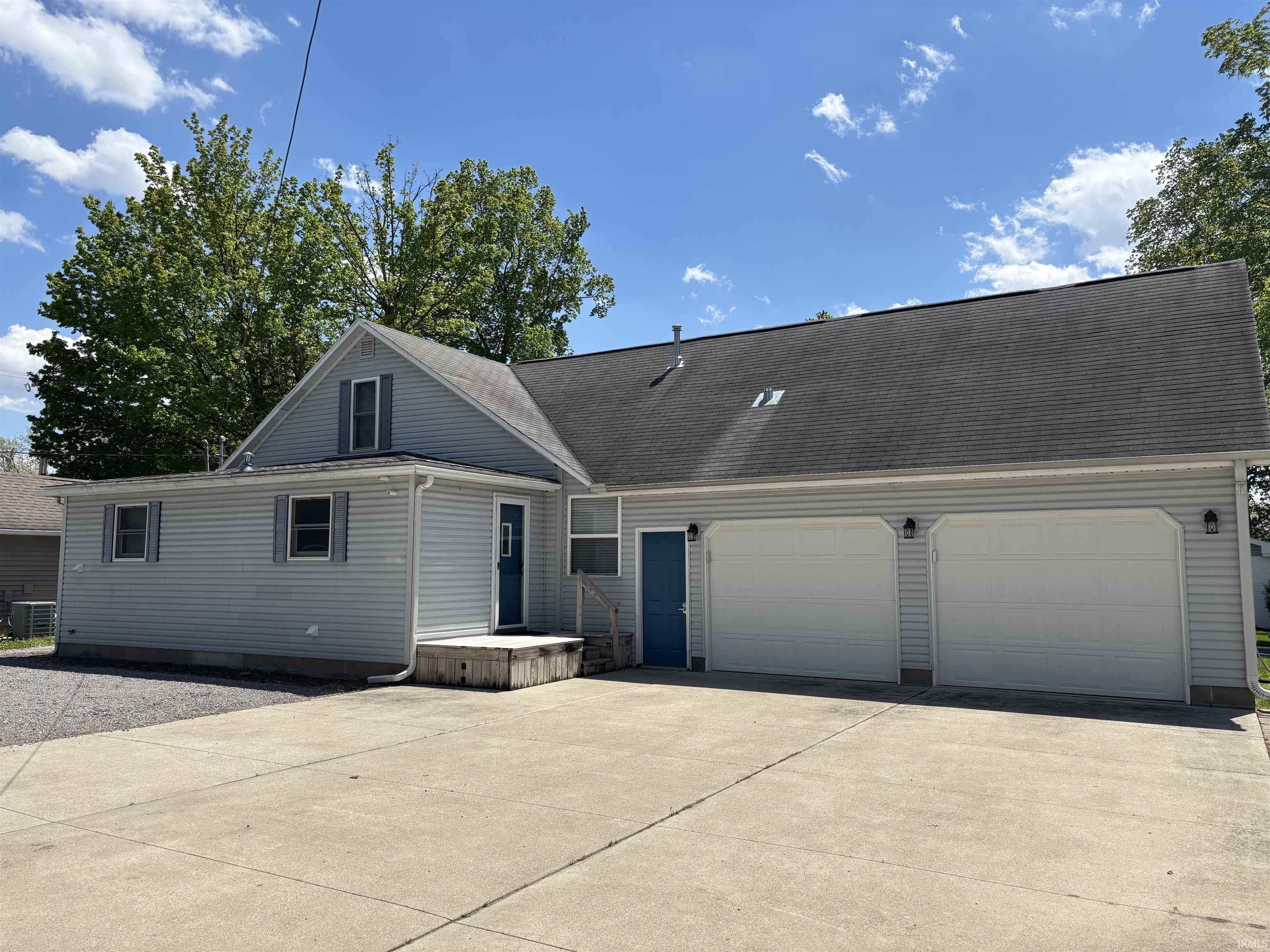 Image 1: Exterior featuring light gray siding, dark gray asphalt shingle roofing, and a concrete driveway, Front Of Structure Image 1: Exterior featuring light gray siding, dark gray asphalt shingle roofing, and a concrete driveway, Front Of Structure