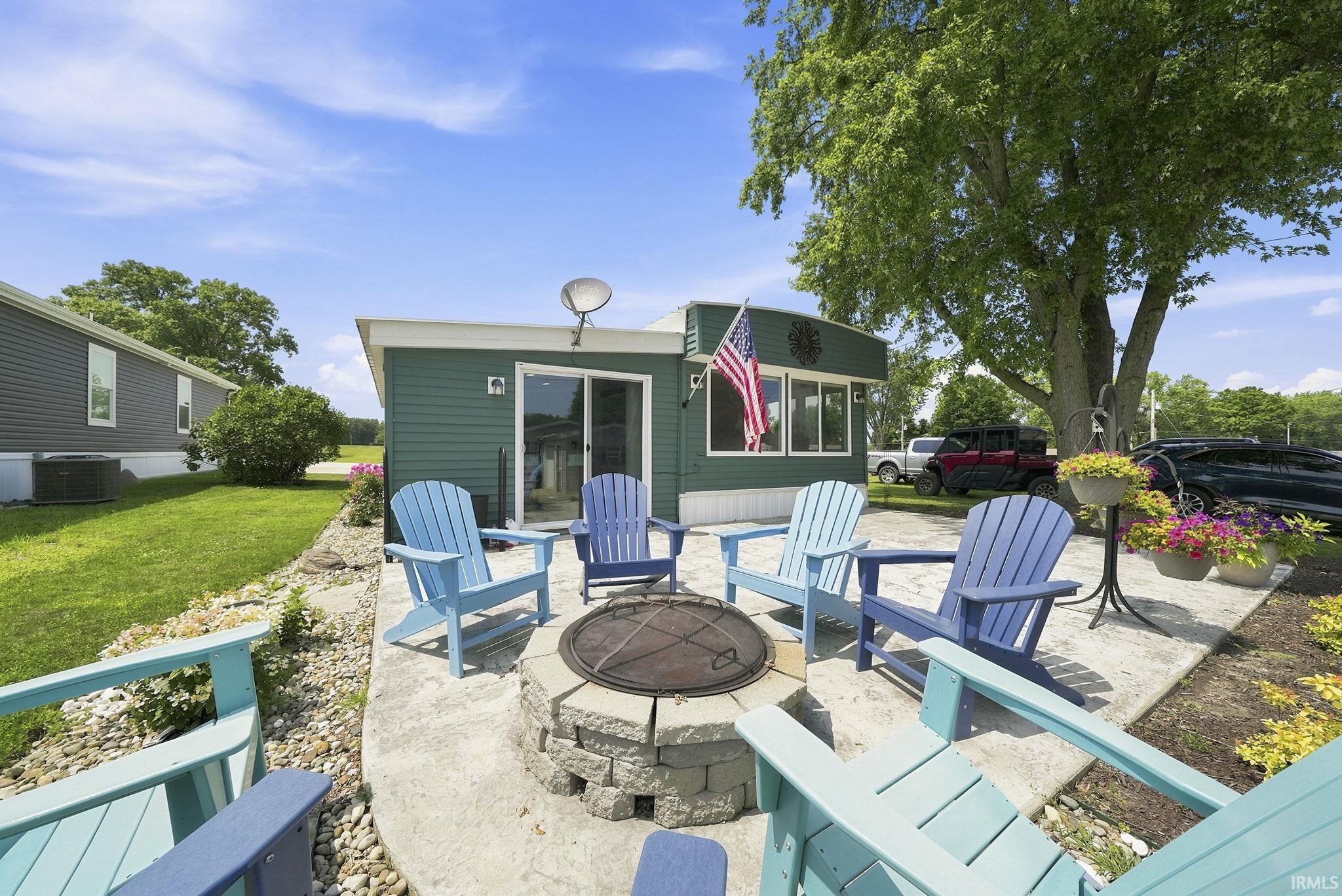 Image 3: Concrete patio with a stone fire pit, Patio Image 3: Concrete patio with a stone fire pit, Patio
