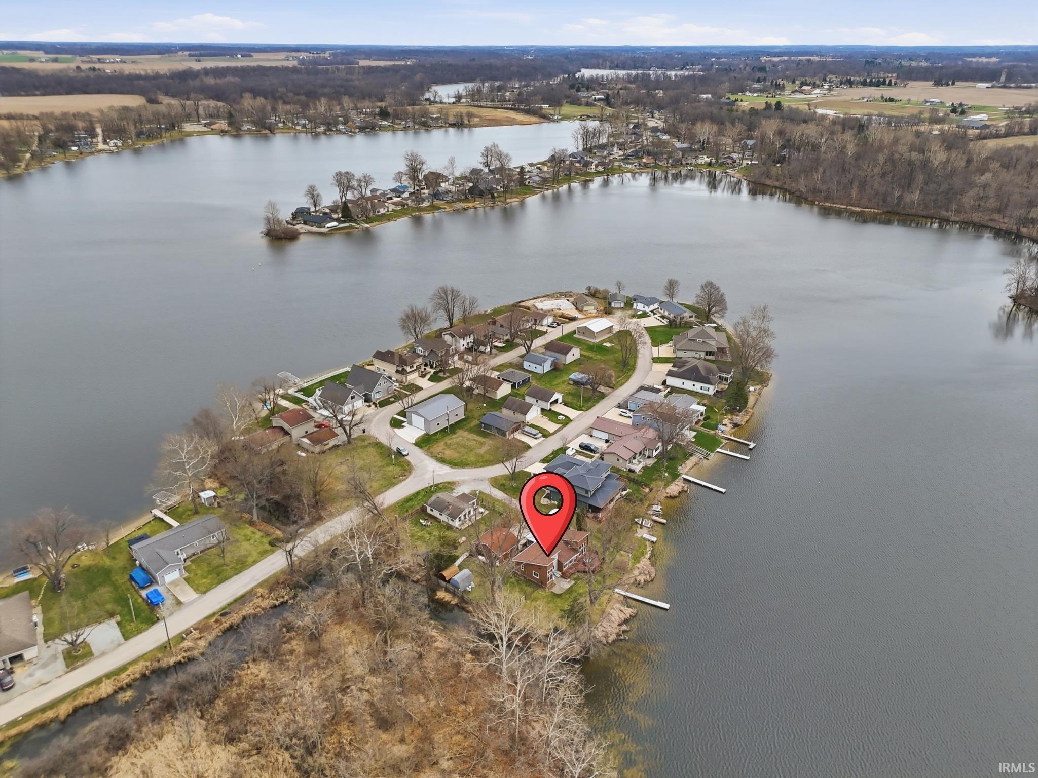 Image 2: Aerial view of residential area featuring a large body of water, Aerial View