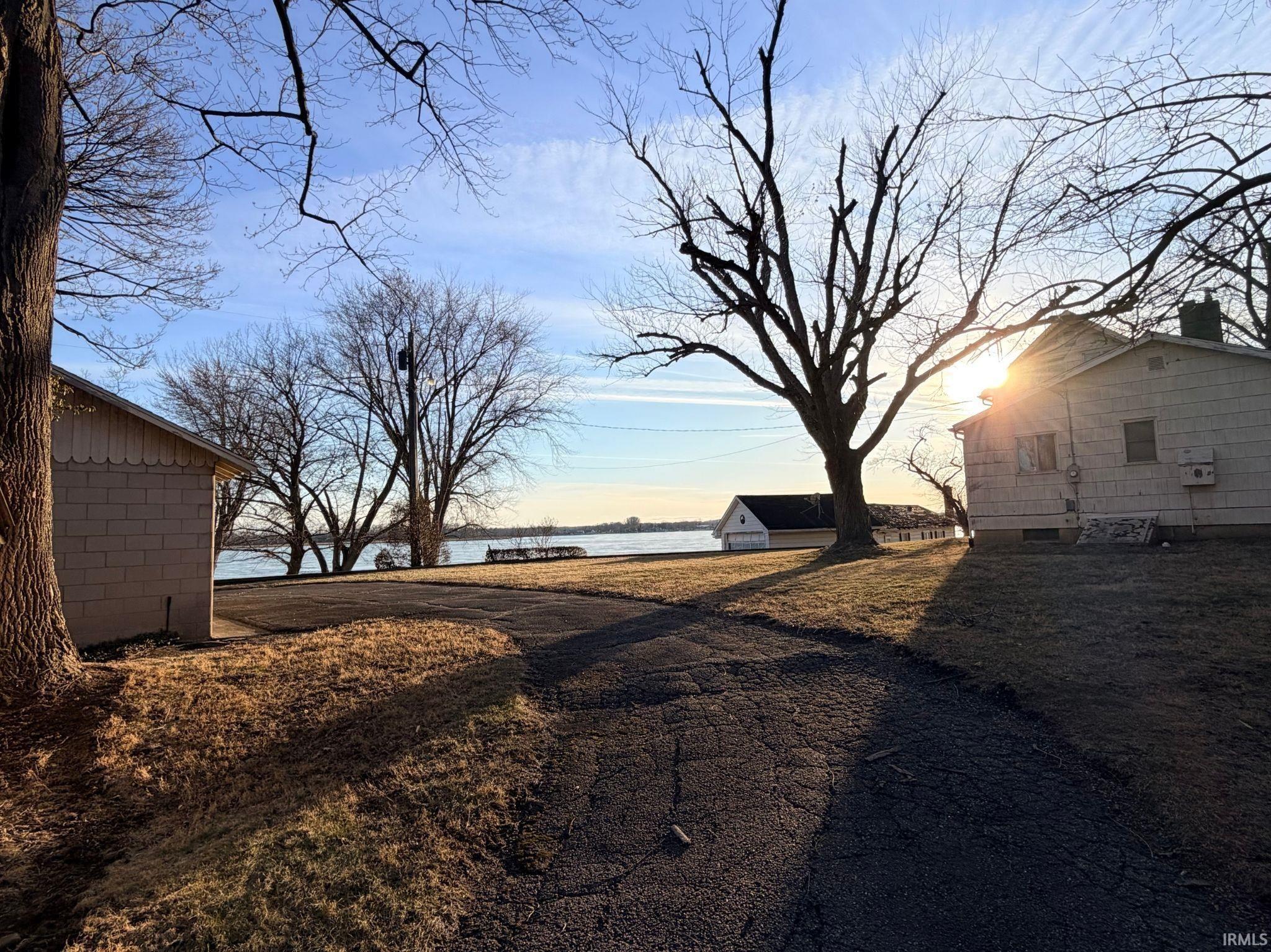 Image 2: View of yard, Sunset lake view over 1.27 acres Image 2: View of yard, Sunset lake view over 1.27 acres