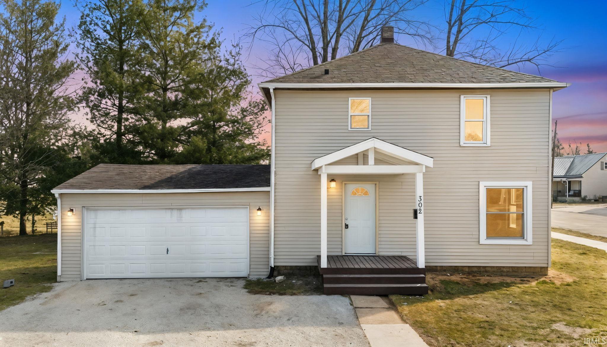 Image 0: View of front facade featuring a garage, roof with shingles, driveway, and a front lawn, Front Of Structure Image 0: View of front facade featuring a garage, roof with shingles, driveway, and a front lawn, Front Of Structure
