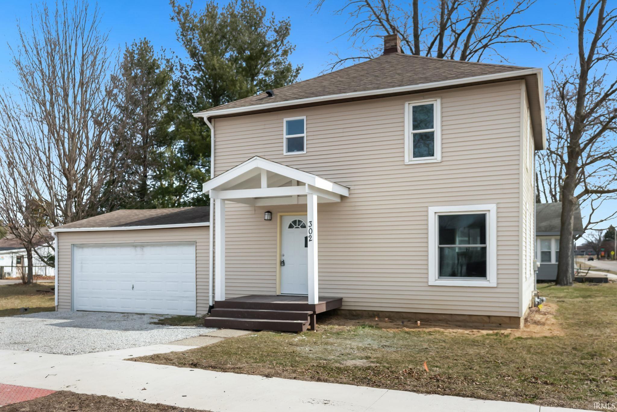 Image 1: Traditional-style home with roof with shingles, driveway, a chimney, an attached garage, and a front yard, Front Of Structure Image 1: Traditional-style home with roof with shingles, driveway, a chimney, an attached garage, and a front yard, Front Of Structure