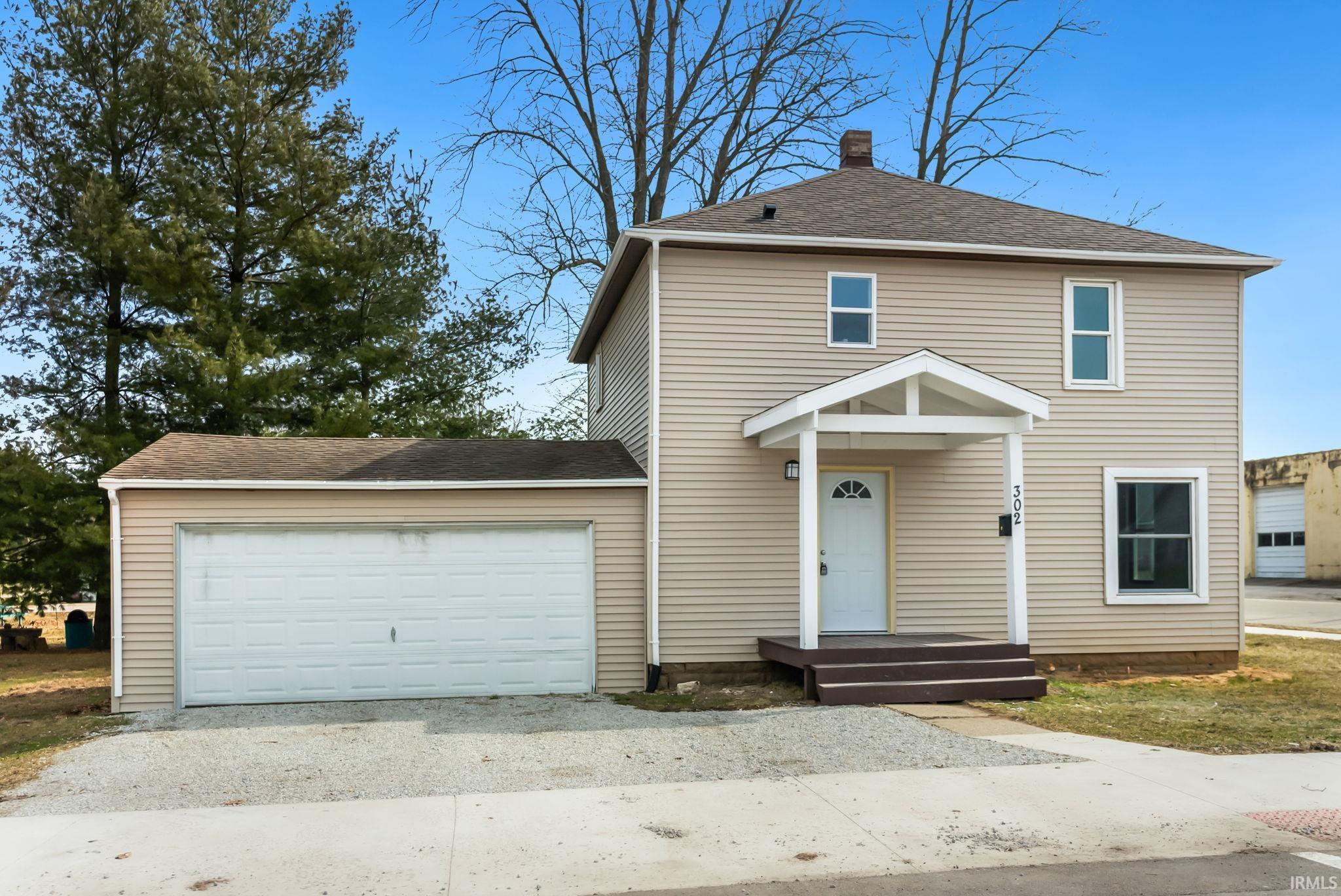 Image 2: View of front facade featuring roof with shingles, an attached garage, and driveway, Front Of Structure Image 2: View of front facade featuring roof with shingles, an attached garage, and driveway, Front Of Structure