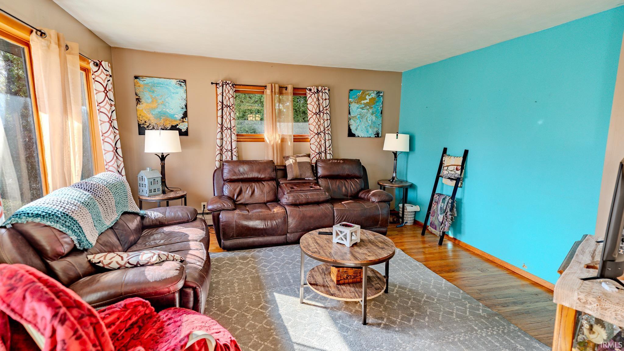 Image 2: Living room featuring wood finished floors and baseboards, Living Room
