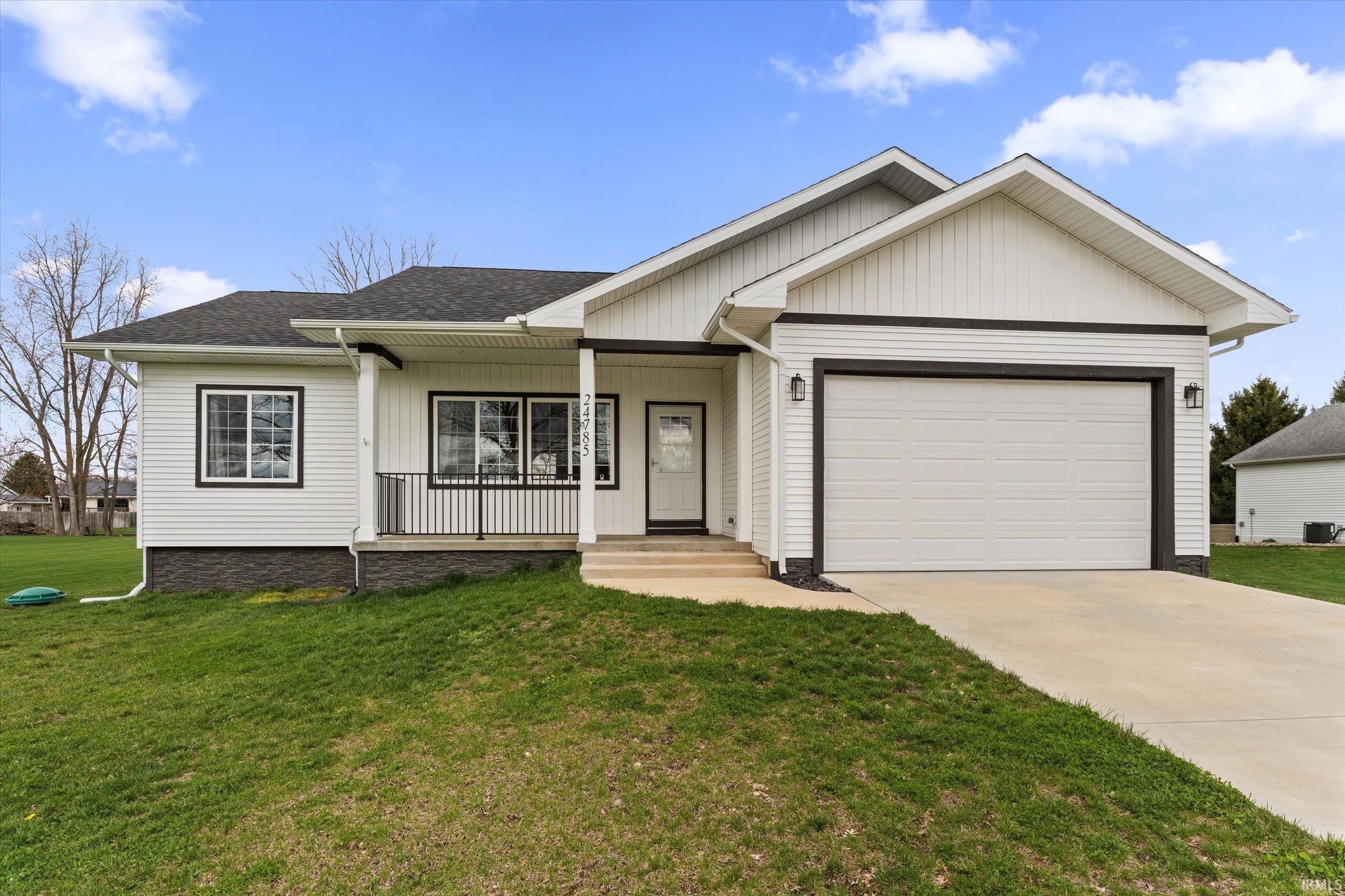 Image 0: Single story home featuring an attached garage, concrete driveway, a front lawn, covered porch, and roof with shingles, Front Of Structure