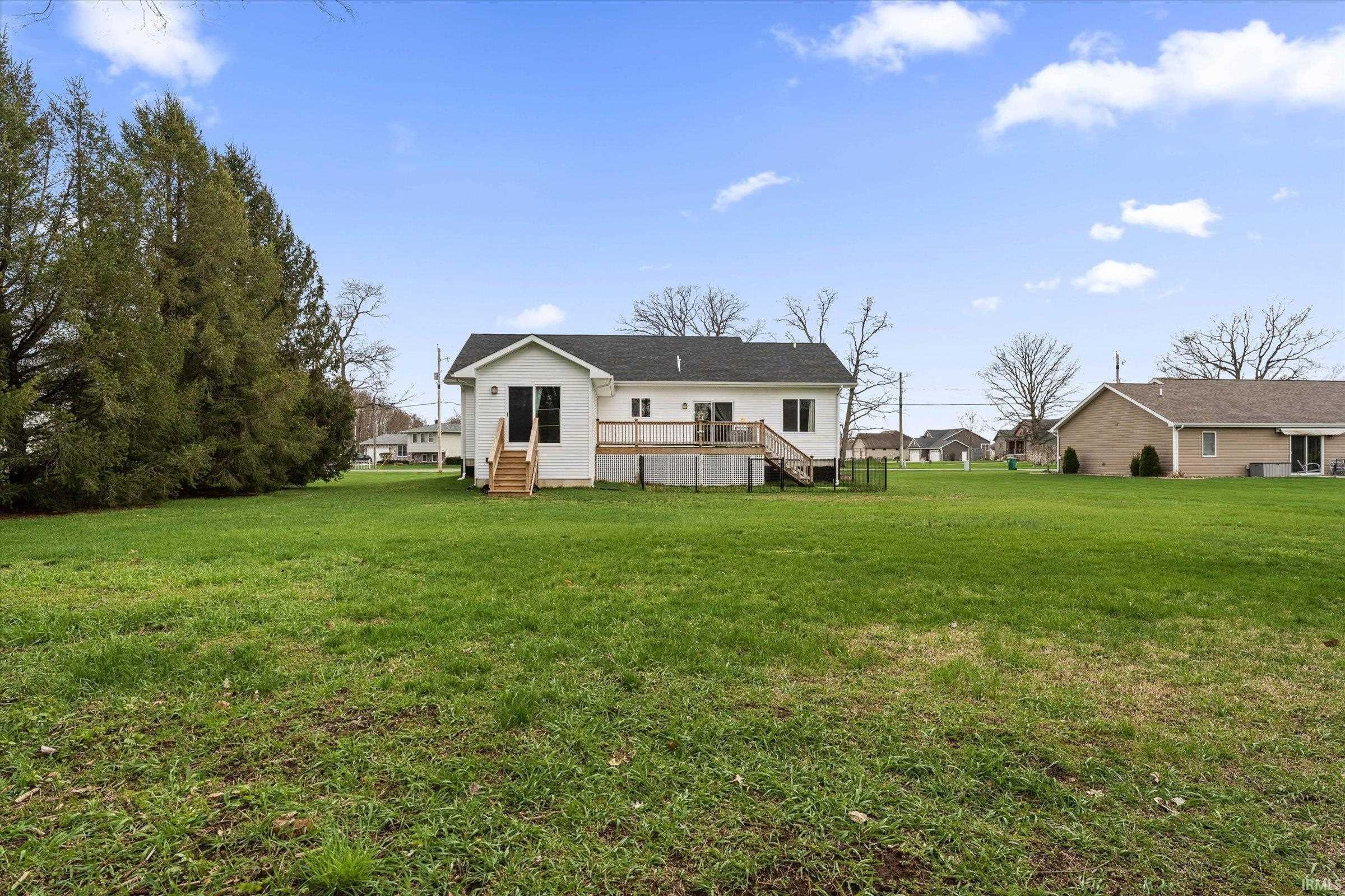 Image 3: Rear view of house featuring a yard and a deck, Back Of Structure