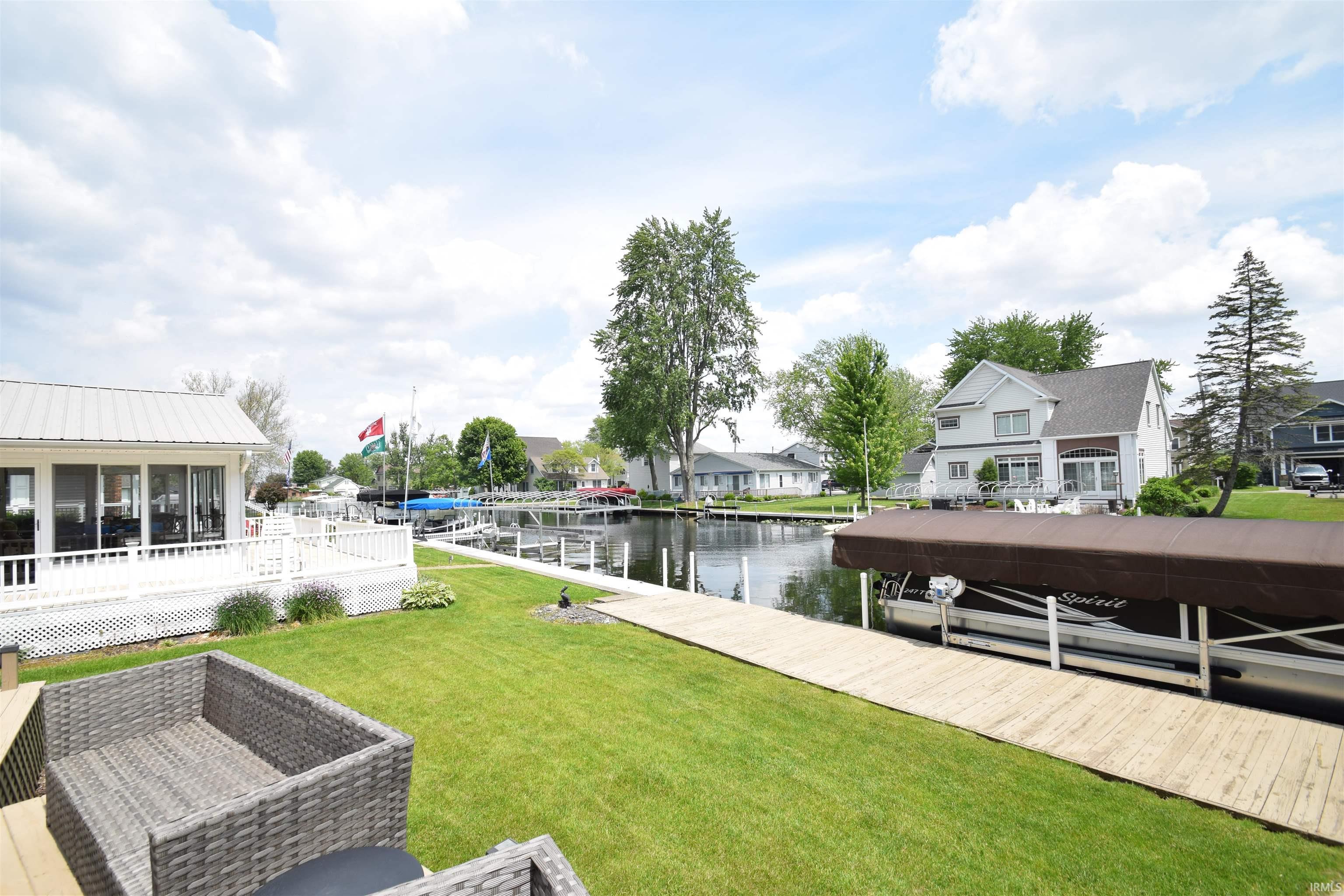 Image 3: Waterfront property with a private dock featuring a boat lift, Dock