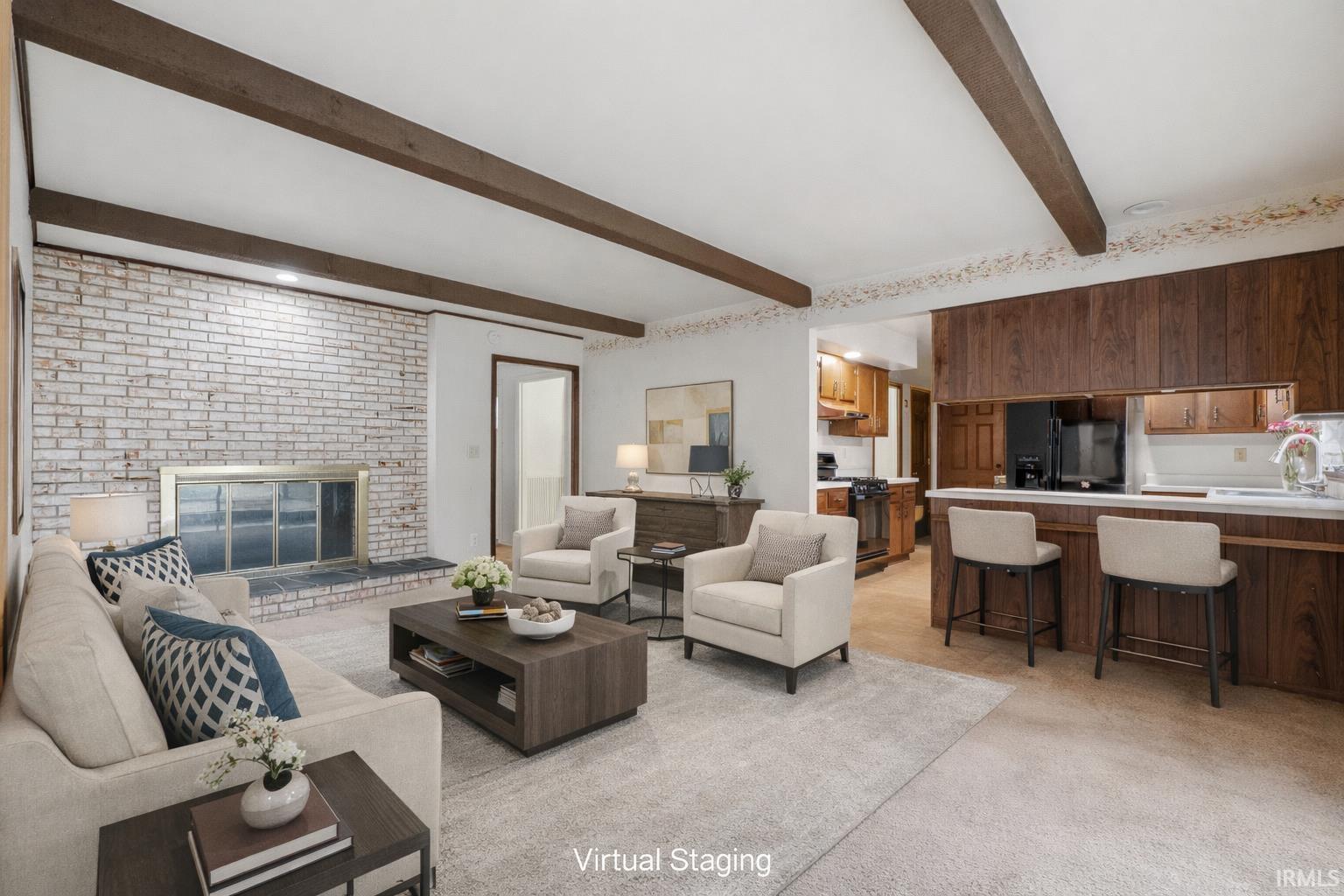 Image 1: Living room with light colored carpet, beamed ceiling, and a brick fireplace, Living Room