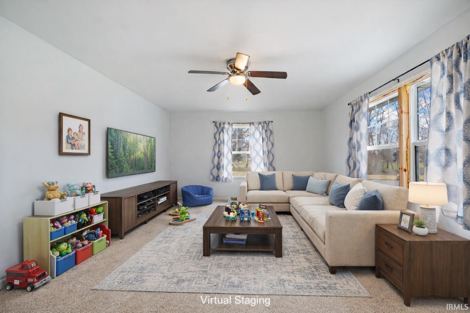 Image 3: Living area with a ceiling fan and carpet, Living Room