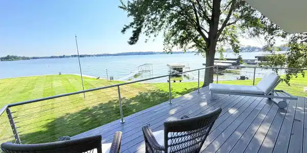 Image 3: Expansive deck featuring composite decking and a cable railing system, Deck