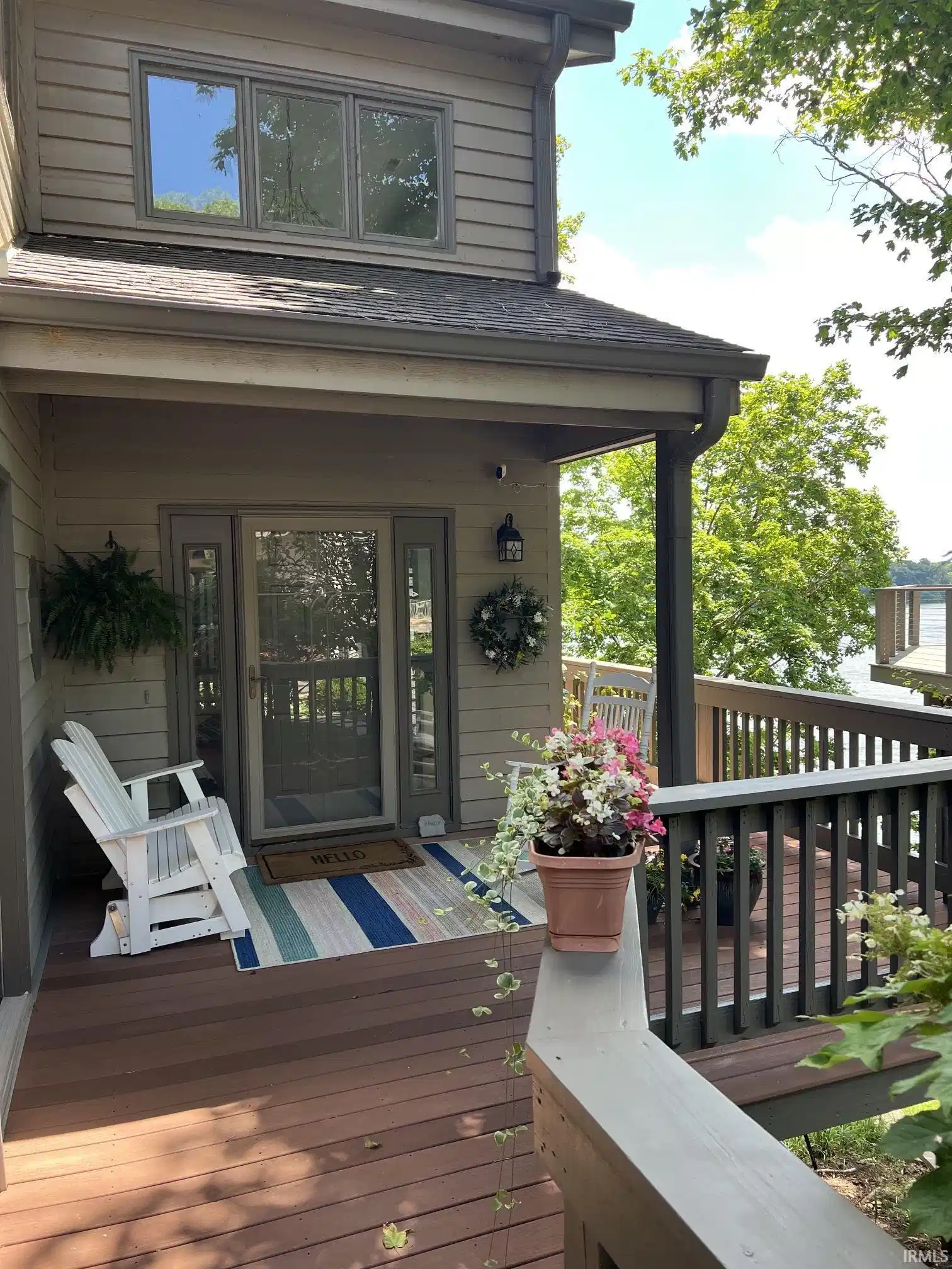 Image 0: Front entry with lake beyond Image 0: Front entry with lake beyond