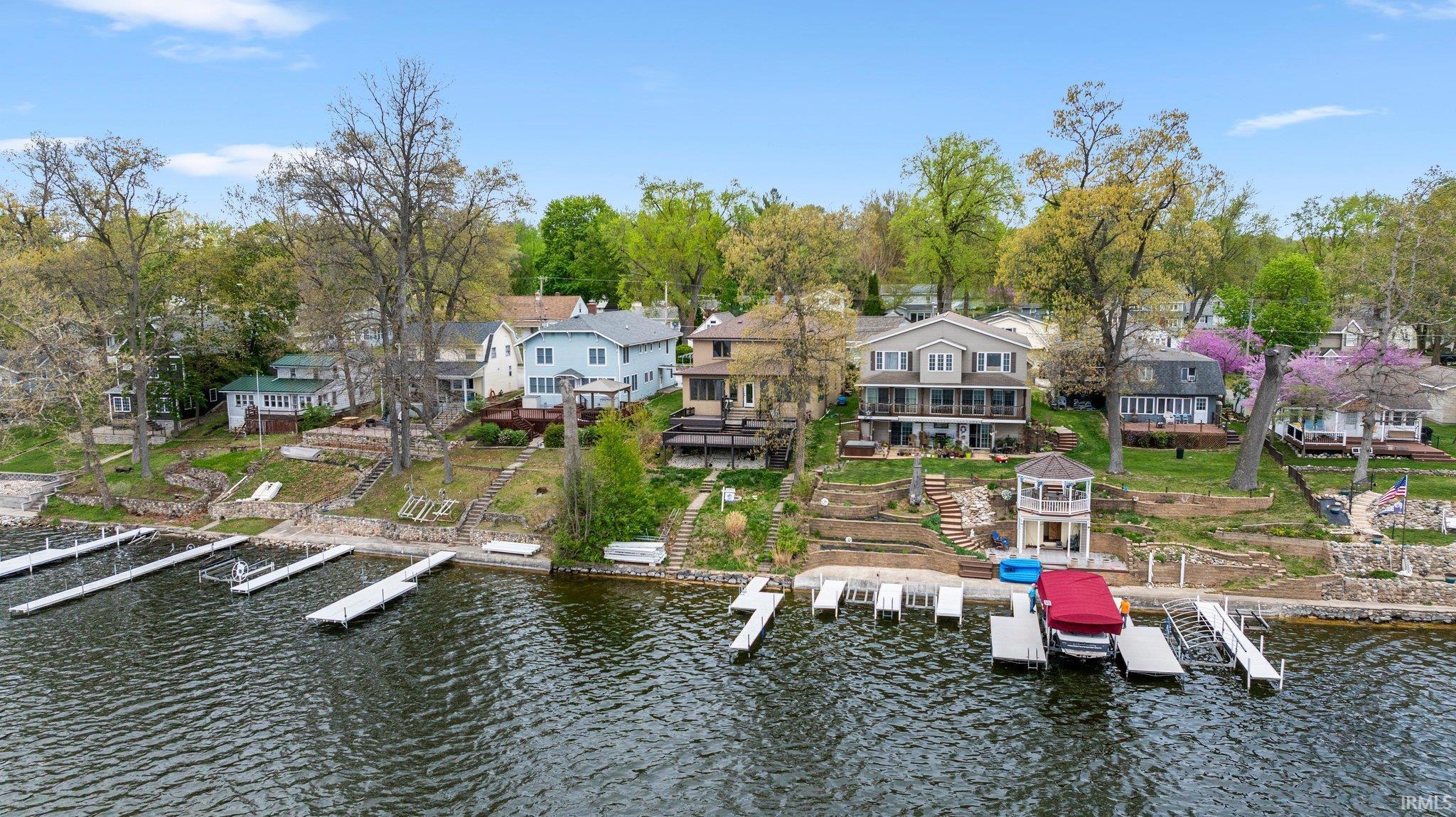 Image 0: Dock area featuring a residential view and a water view, Dock