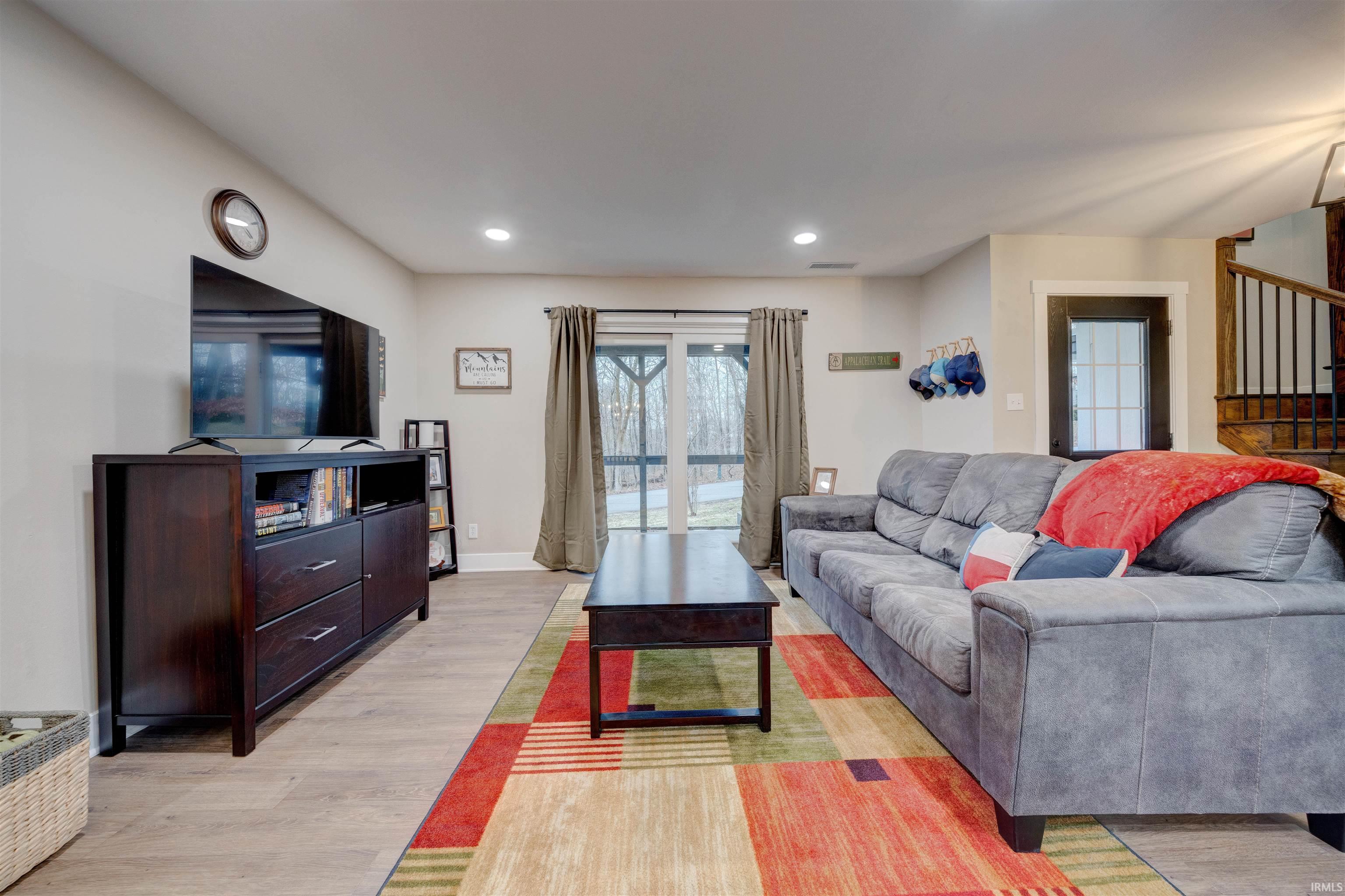 Image 3: Living room featuring light wood-type flooring and recessed lighting, Living Room