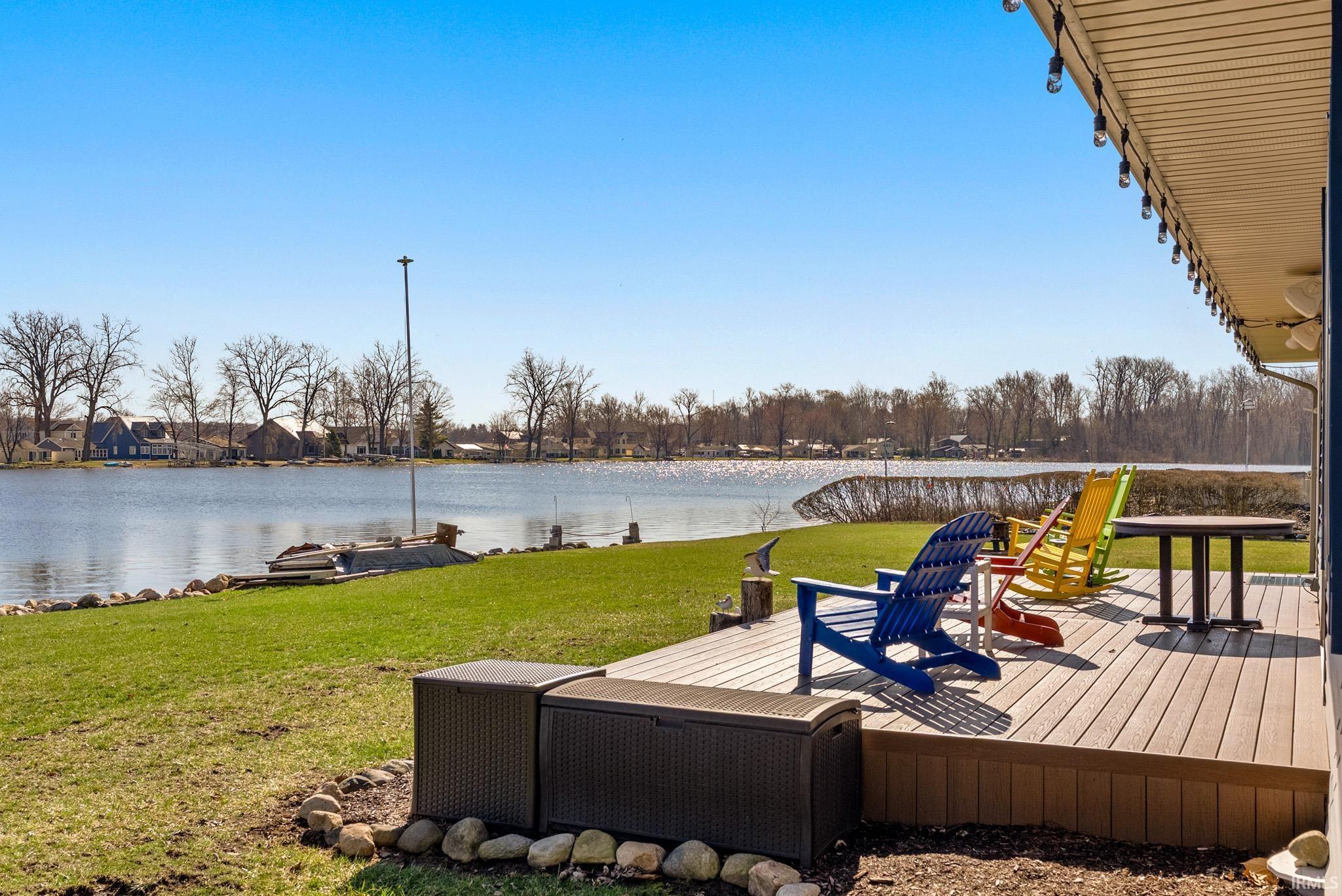 Image 1: Wooden deck with a yard and a water view, Deck