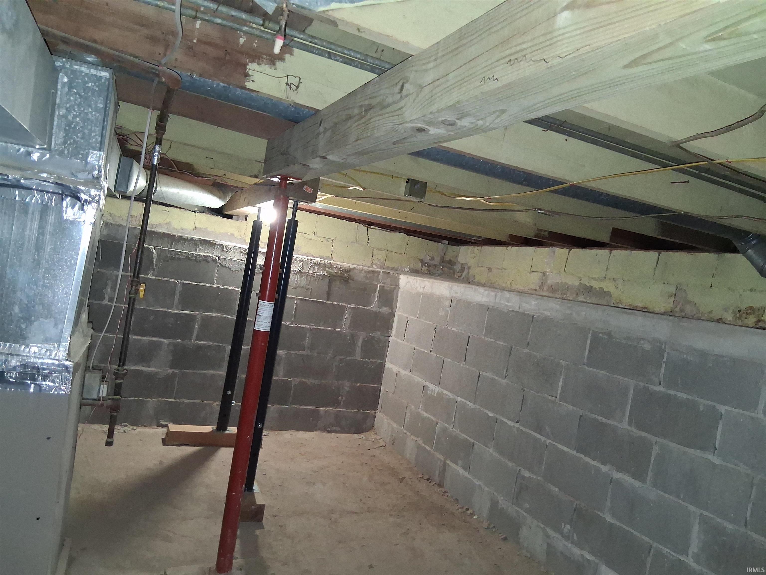 Image 1: Unfinished below grade area featuring heating unit, Basement Image 1: Unfinished below grade area featuring heating unit, Basement