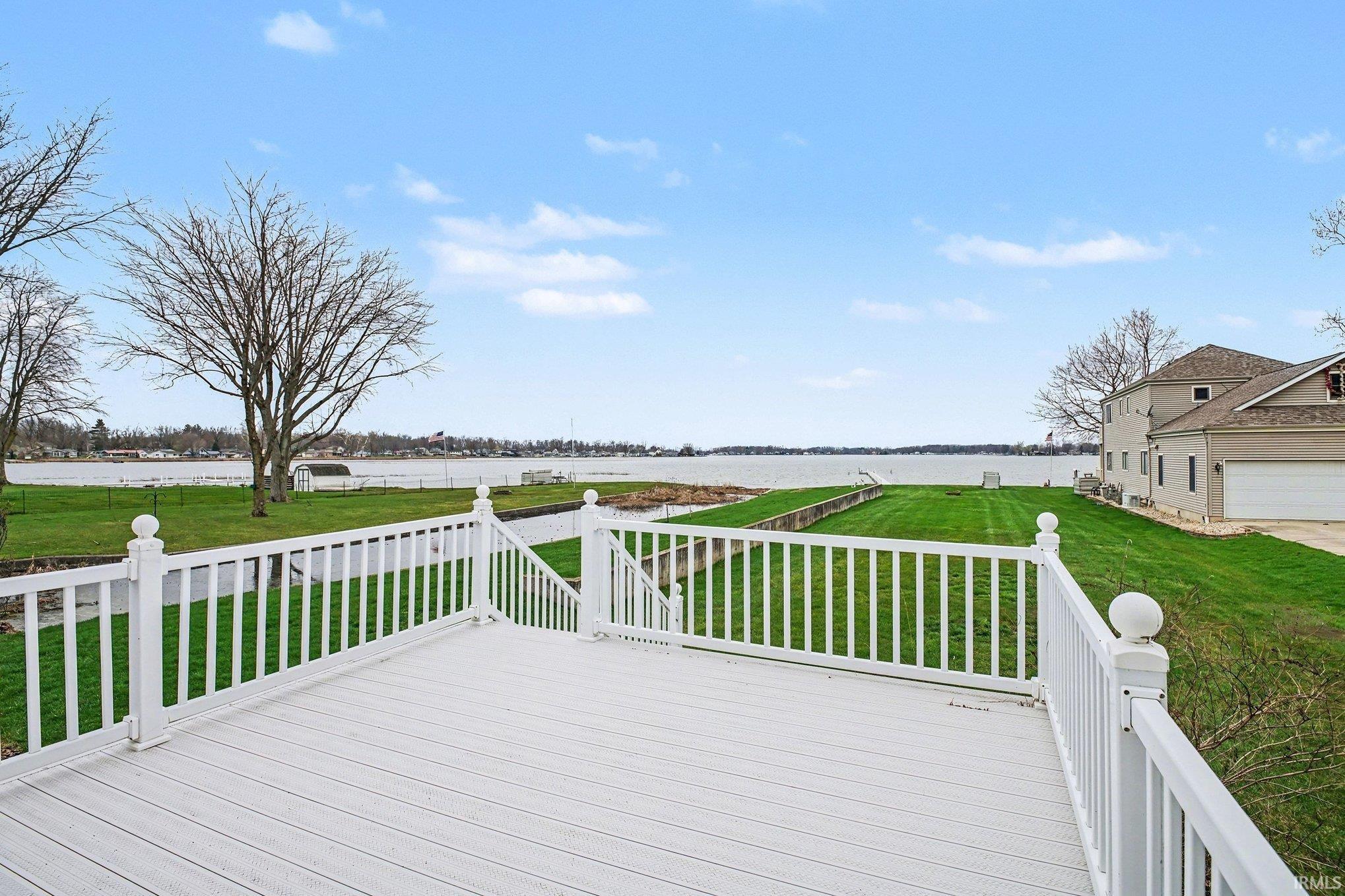 Image 2: Deck with a water view and a lawn, Deck