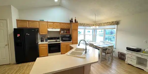 Image 1: Kitchen featuring vaulted ceilings with recessed and track lighting, Kitchen Image 1: Kitchen featuring vaulted ceilings with recessed and track lighting, Kitchen