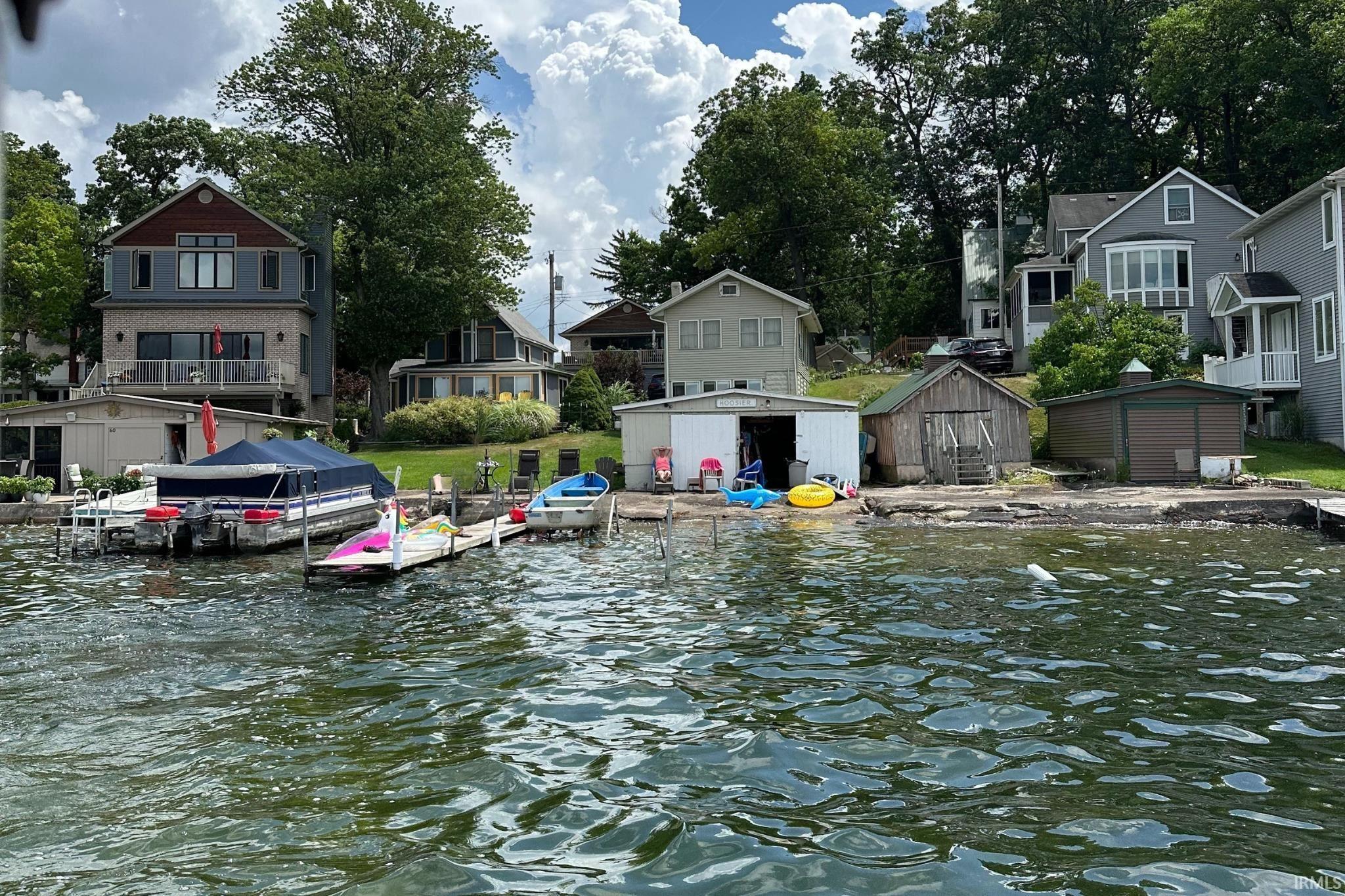 Image 0: Dock area with a residential view and a water view, Dock Image 0: Dock area with a residential view and a water view, Dock
