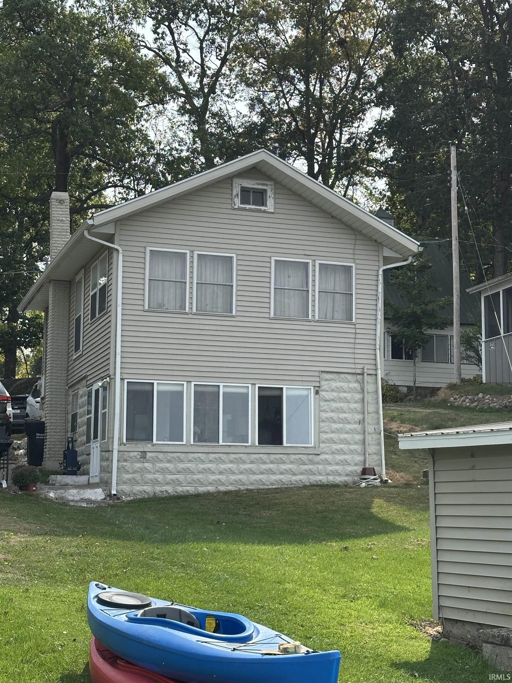 Image 1: View of side of property featuring a chimney and a lawn, Side Of Structure Image 1: View of side of property featuring a chimney and a lawn, Side Of Structure