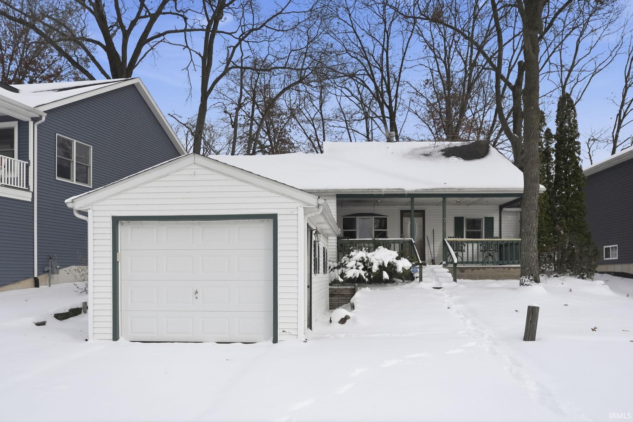 Image 0: View of front of house featuring a porch, Front Of Structure