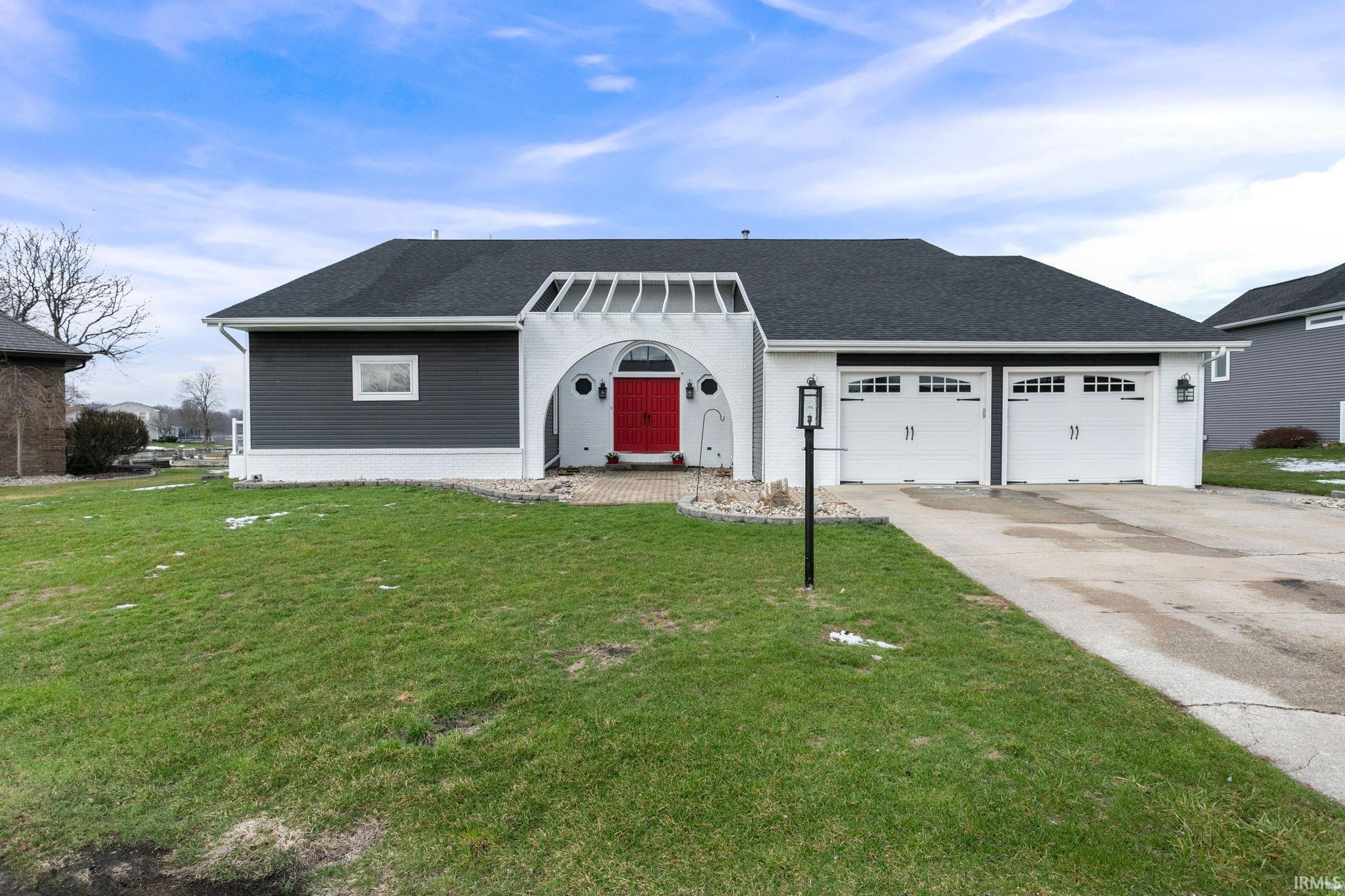 Image 1: View of front facade with roof with shingles, a front lawn, driveway, and an attached garage, Front Of Structure