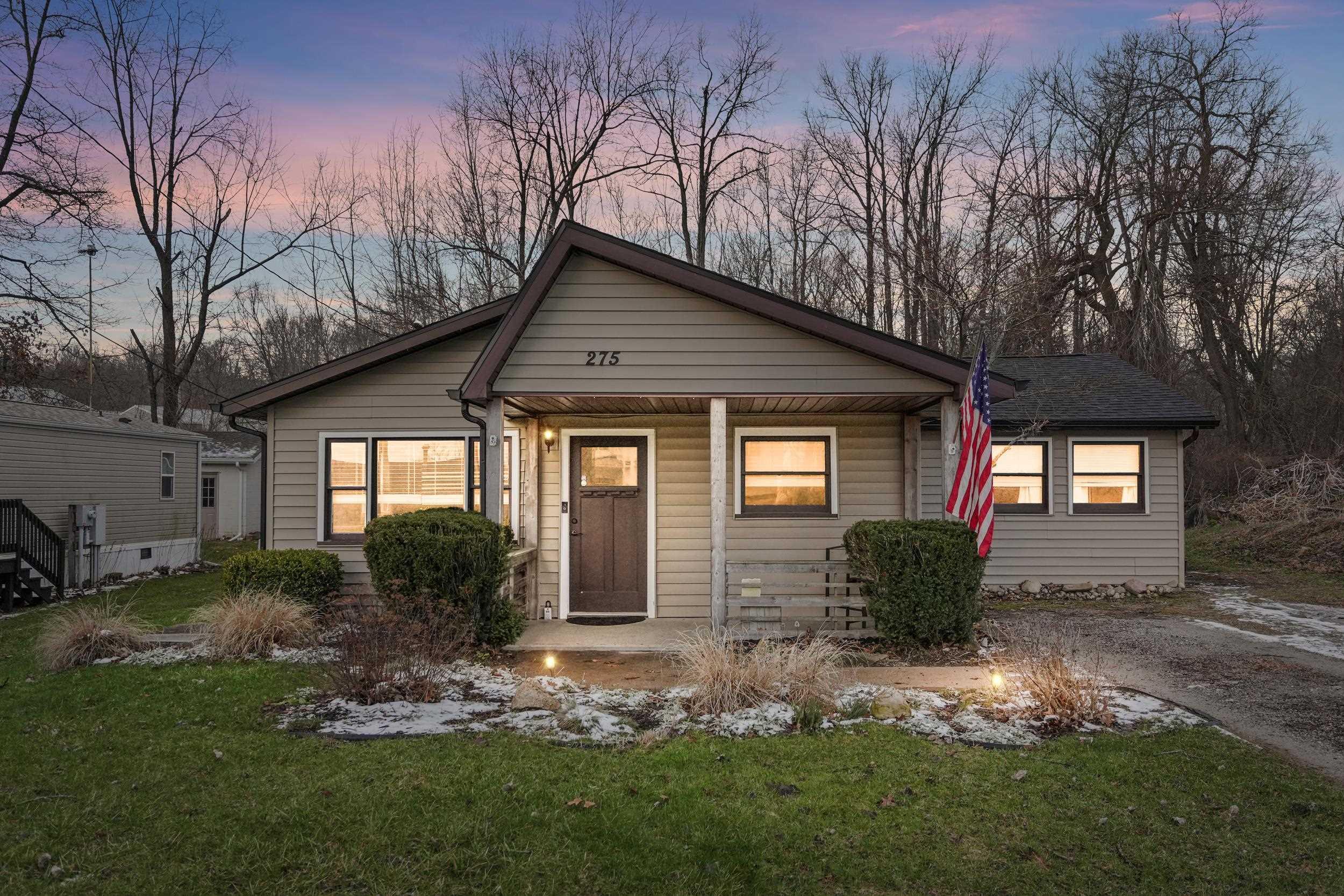 Image 0: Bungalow featuring a porch and a yard, Front Of Structure