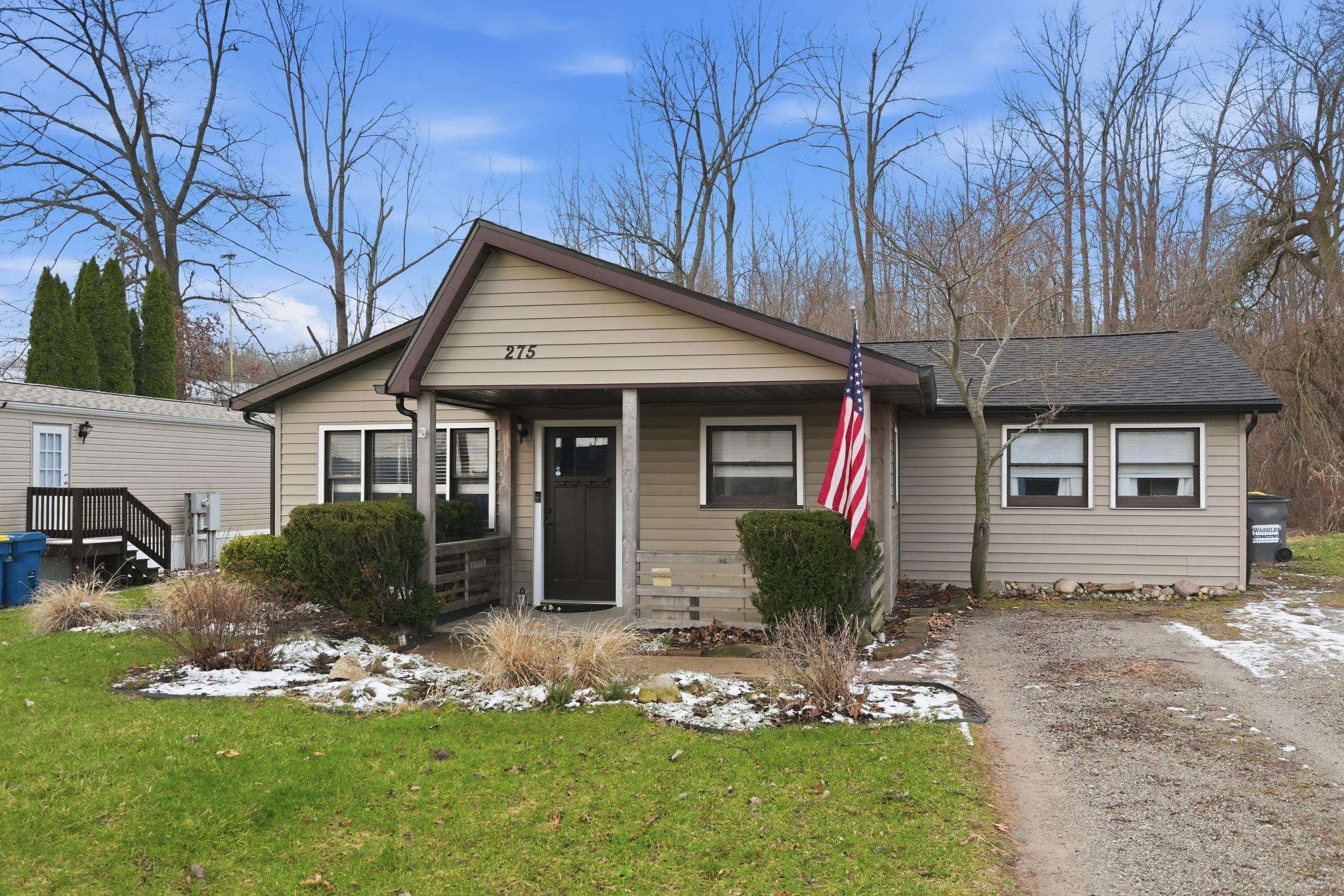 Image 1: Bungalow with a front lawn, Front Of Structure