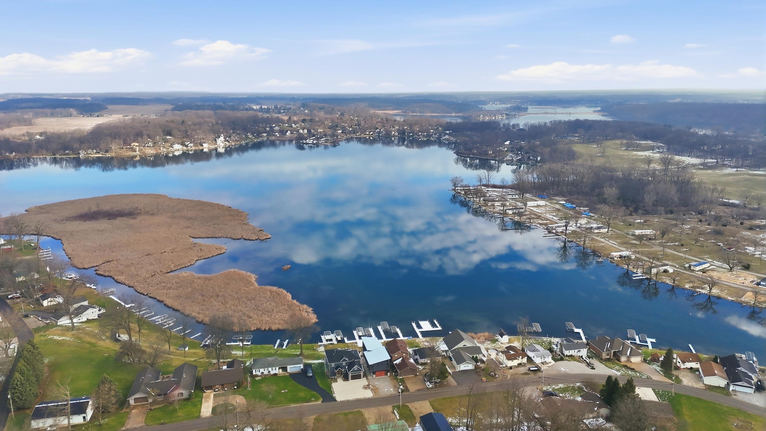 Image 2: Aerial view of residential area featuring a nearby body of water, Aerial View