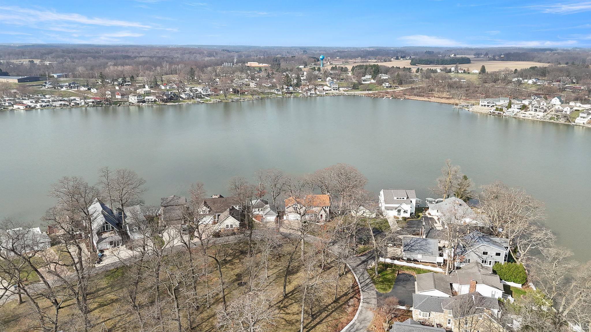 Image 2: Aerial view of residential area featuring a nearby body of water, Aerial View Image 2: Aerial view of residential area featuring a nearby body of water, Aerial View
