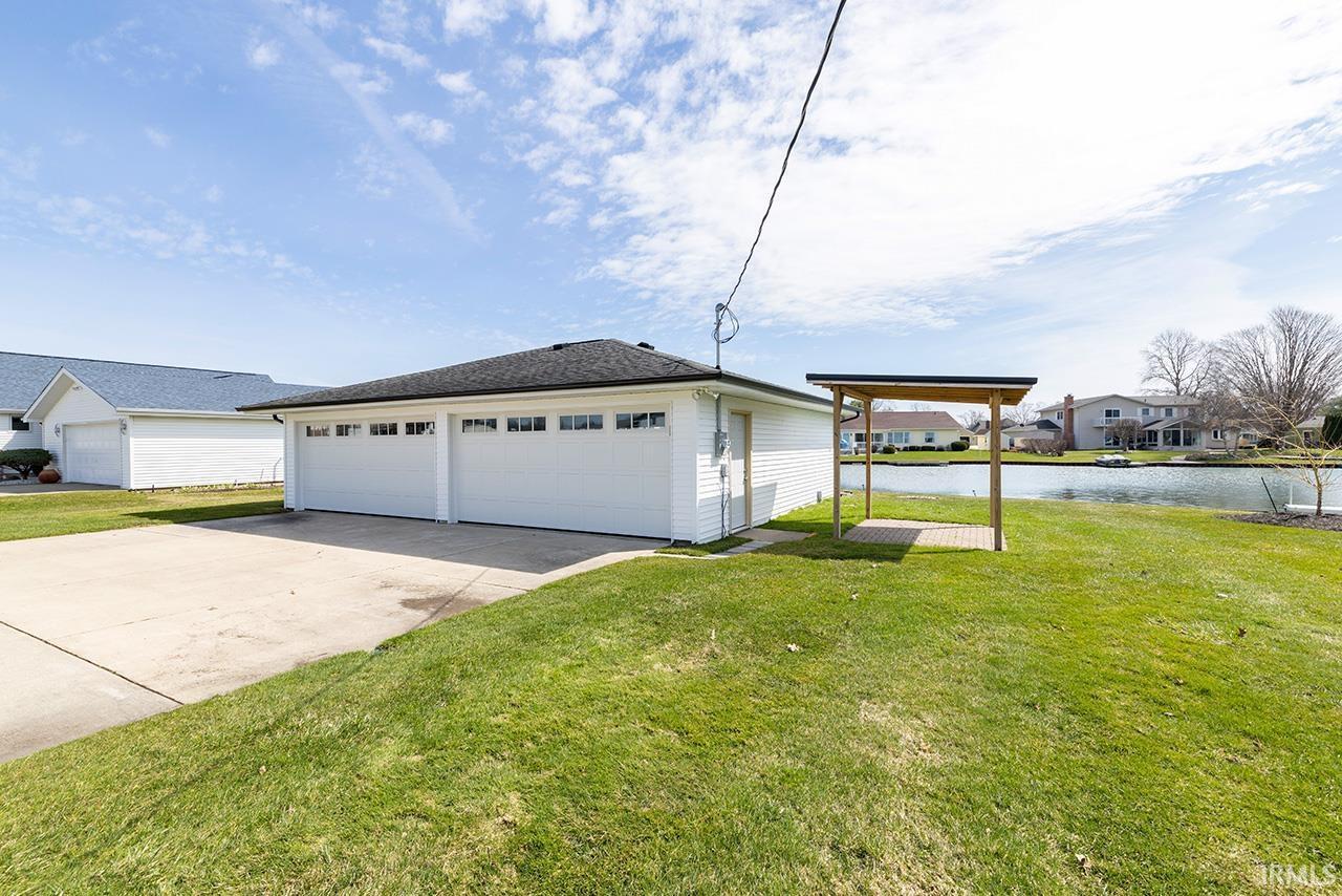 Image 2: Detached garage with a water view and a residential view, Garage