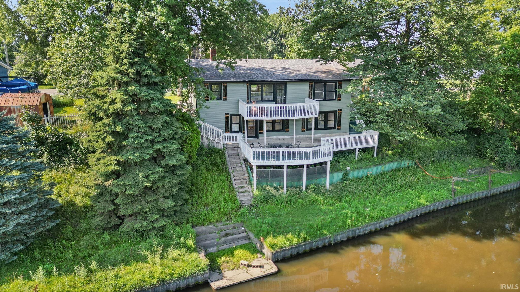 Image 2: Waterfront property with multi-level outdoor decking and a private dock, Back Of Structure
