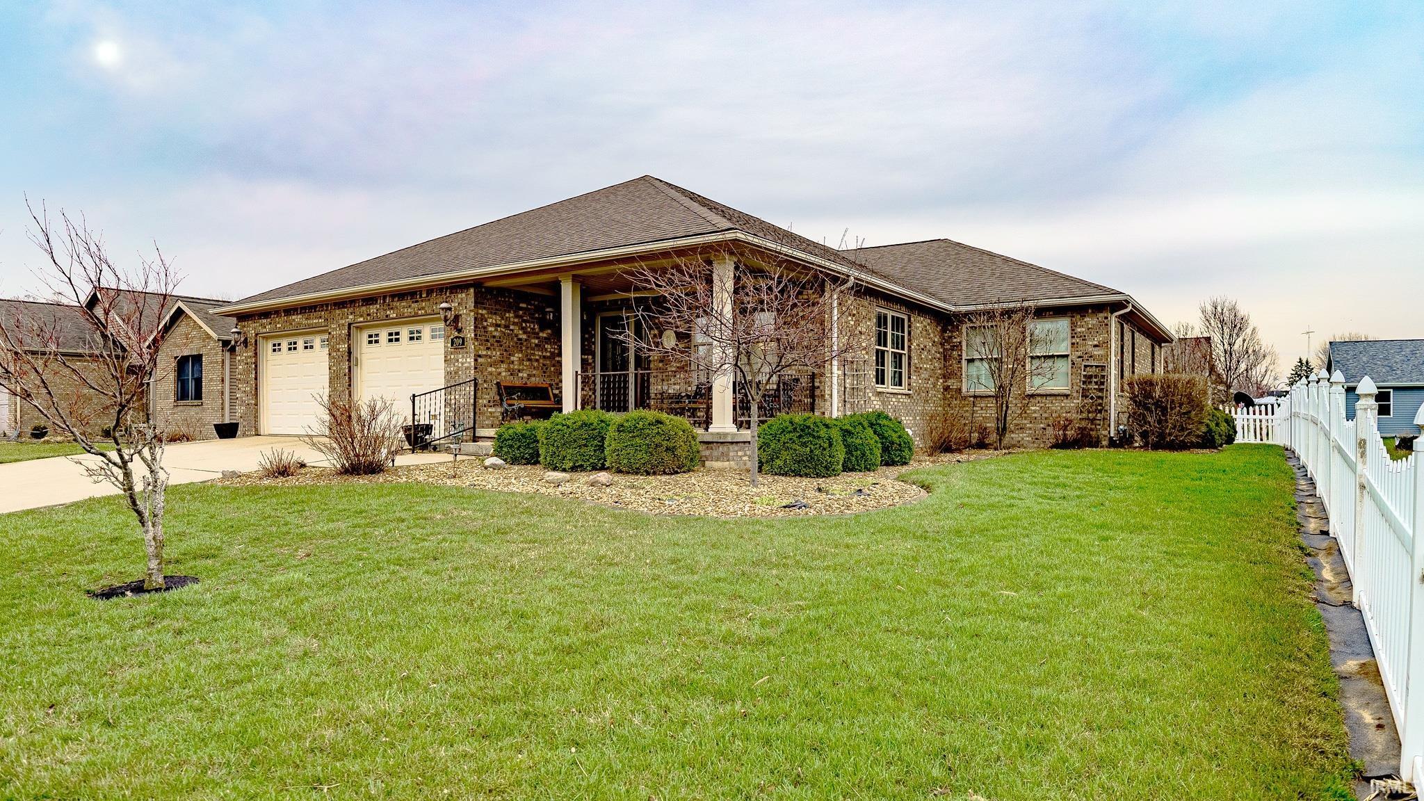 Image 0: Ranch-style home featuring brick siding, an attached garage, concrete driveway, and roof with shingles, Front Of Structure