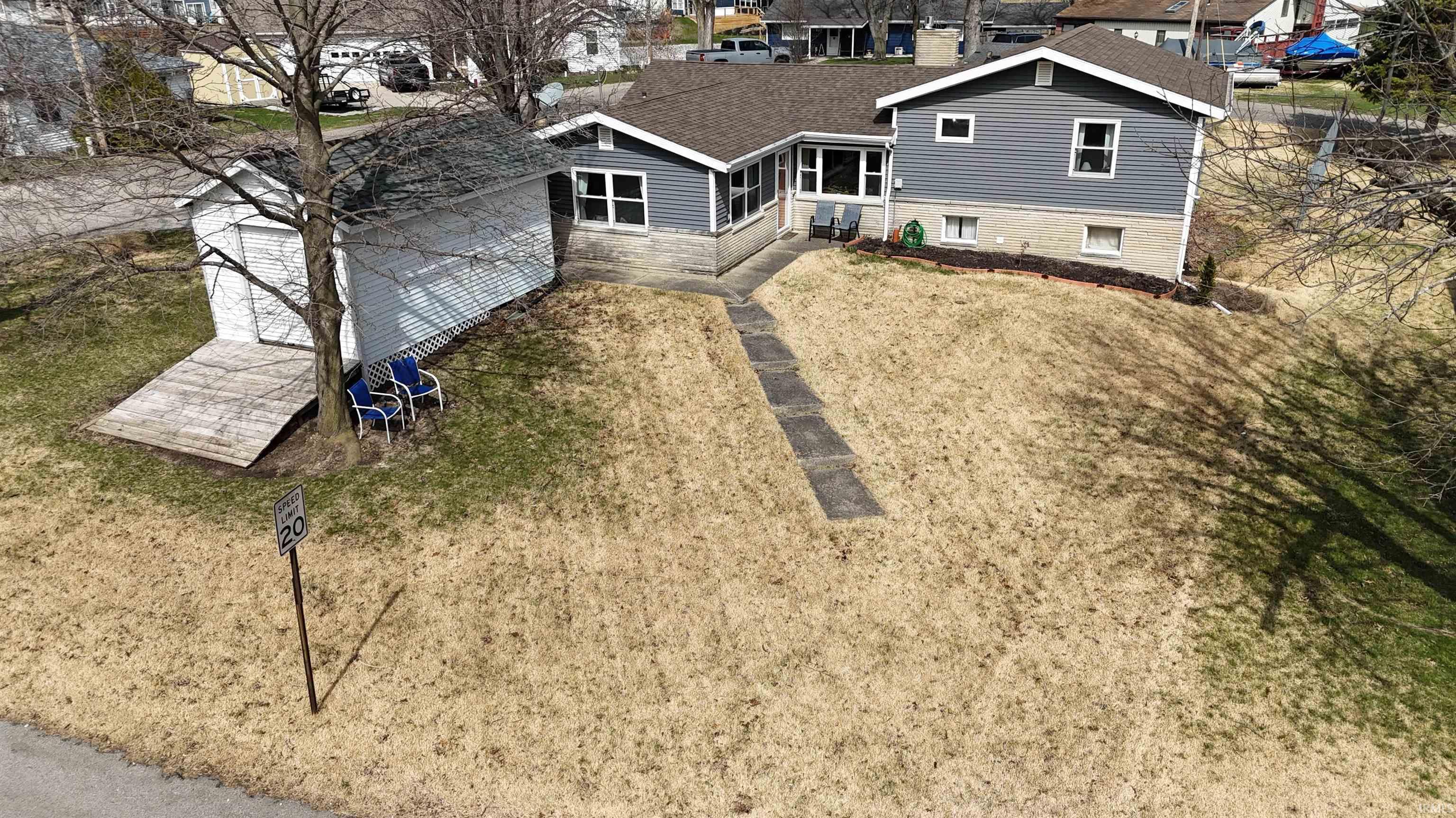 Image 2: Back of house featuring roof with shingles, Back Of Structure Image 2: Back of house featuring roof with shingles, Back Of Structure