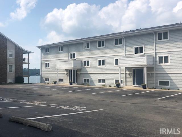 Image 3: View of uncovered parking lot, Parking