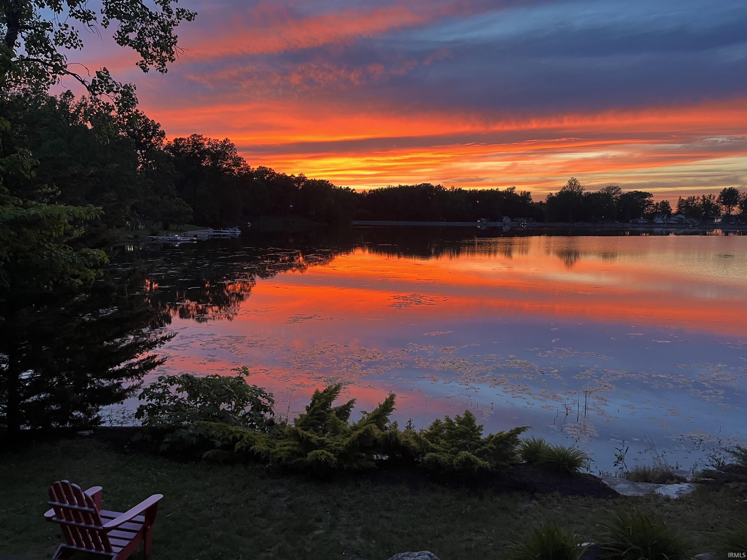 Image 2: Expansive waterfront property with a verdant shoreline and mature trees, View Image 2: Expansive waterfront property with a verdant shoreline and mature trees, View