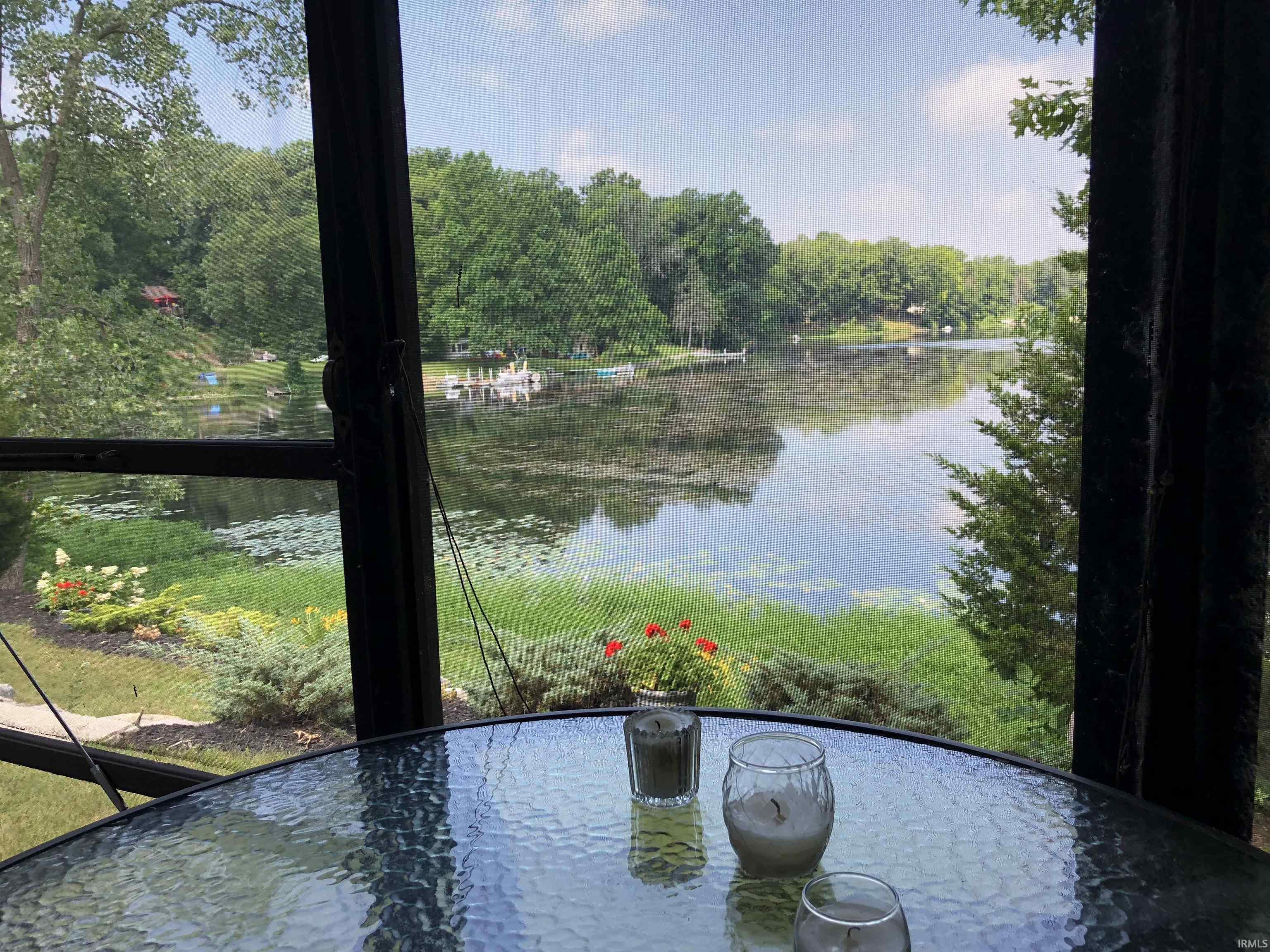 Image 3: Screened enclosure with expansive water frontage, View Image 3: Screened enclosure with expansive water frontage, View