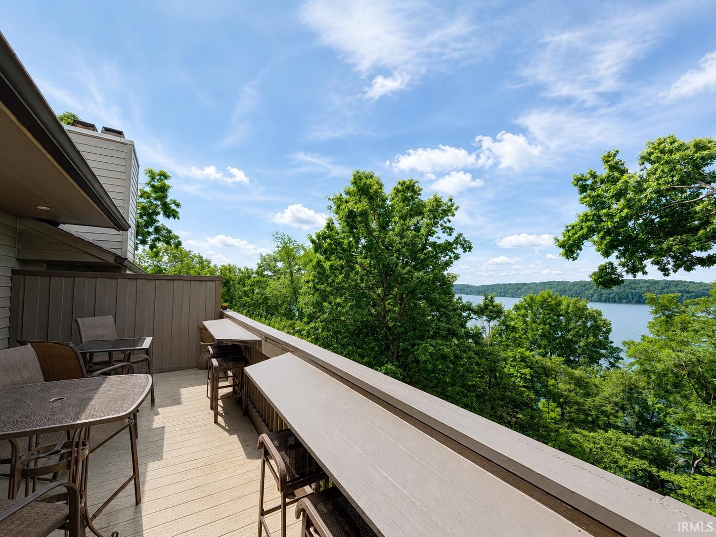 Image 0: Expansive outdoor deck featuring composite flooring and multiple built-in bar-height counters, Deck Image 0: Expansive outdoor deck featuring composite flooring and multiple built-in bar-height counters, Deck