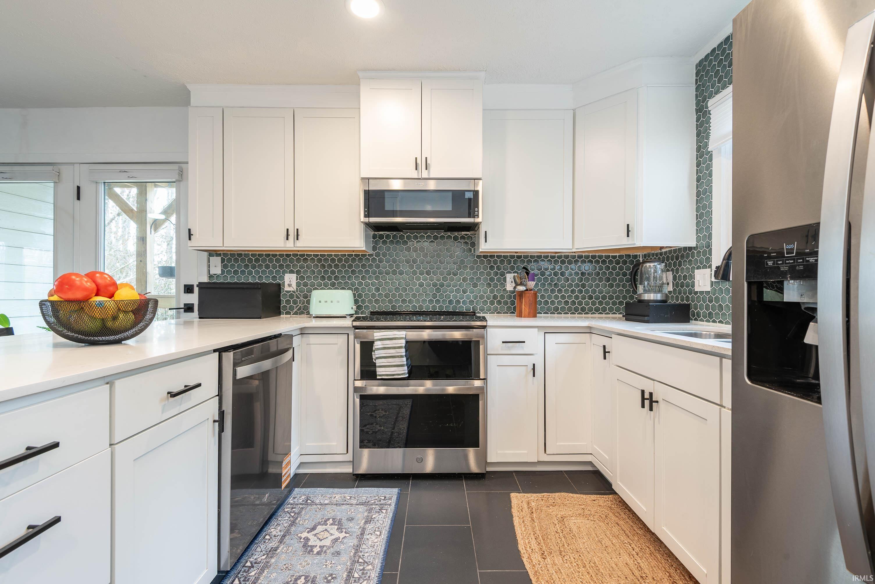 Image 2: Kitchen featuring new stainless steel appliances., Kitchen