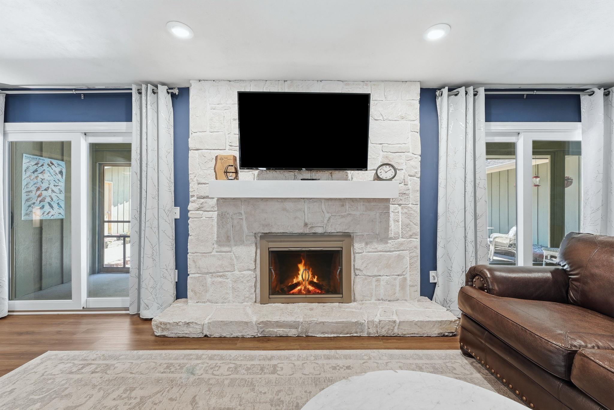 Image 3: Stone-clad fireplace with hearth, integrated firebox, and mantel, Living Room Image 3: Stone-clad fireplace with hearth, integrated firebox, and mantel, Living Room