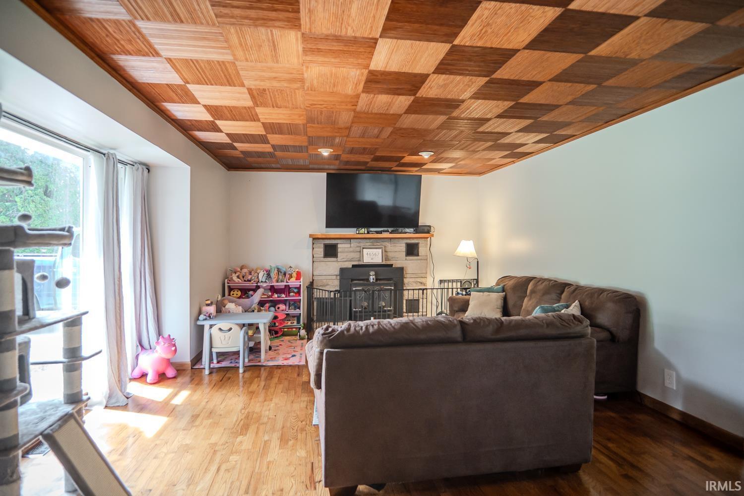 Image 1: Checkered wood-panel ceiling with recessed lighting, Living Room Image 1: Checkered wood-panel ceiling with recessed lighting, Living Room