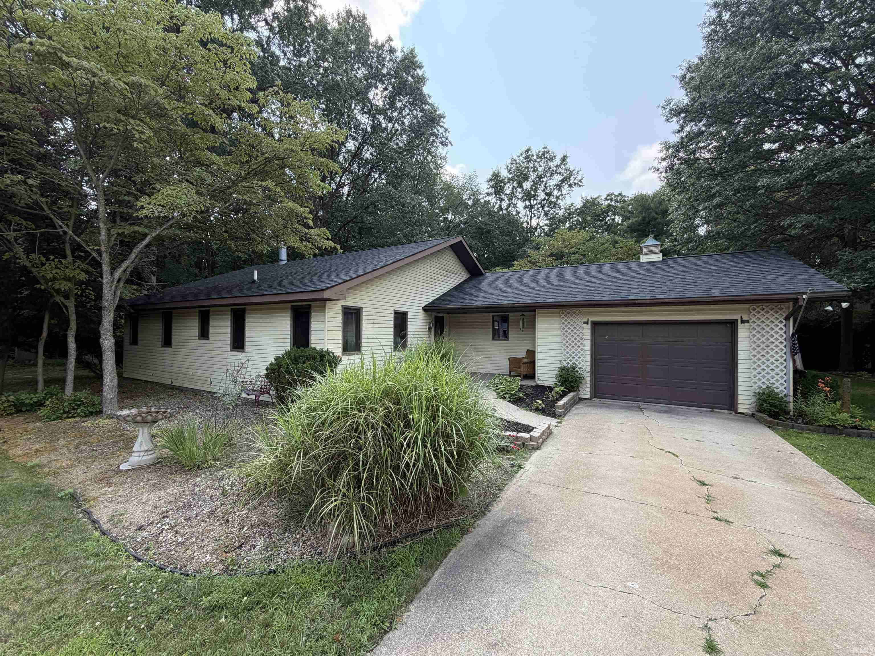 Image 0: Ranch-style residence featuring light-colored siding and dark trim, Front Of Structure Image 0: Ranch-style residence featuring light-colored siding and dark trim, Front Of Structure